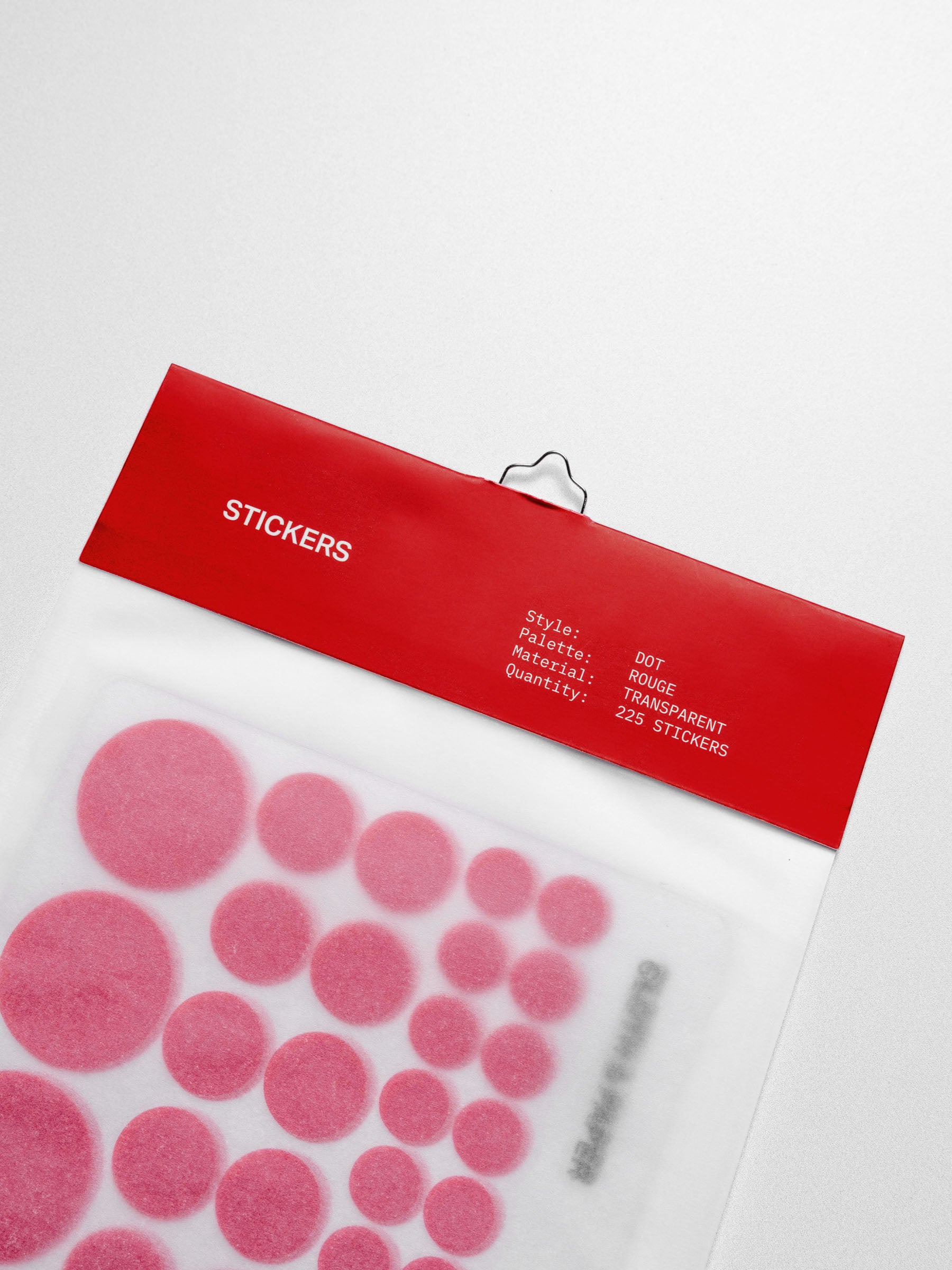 A close-up of the red dot stickers in its packaging