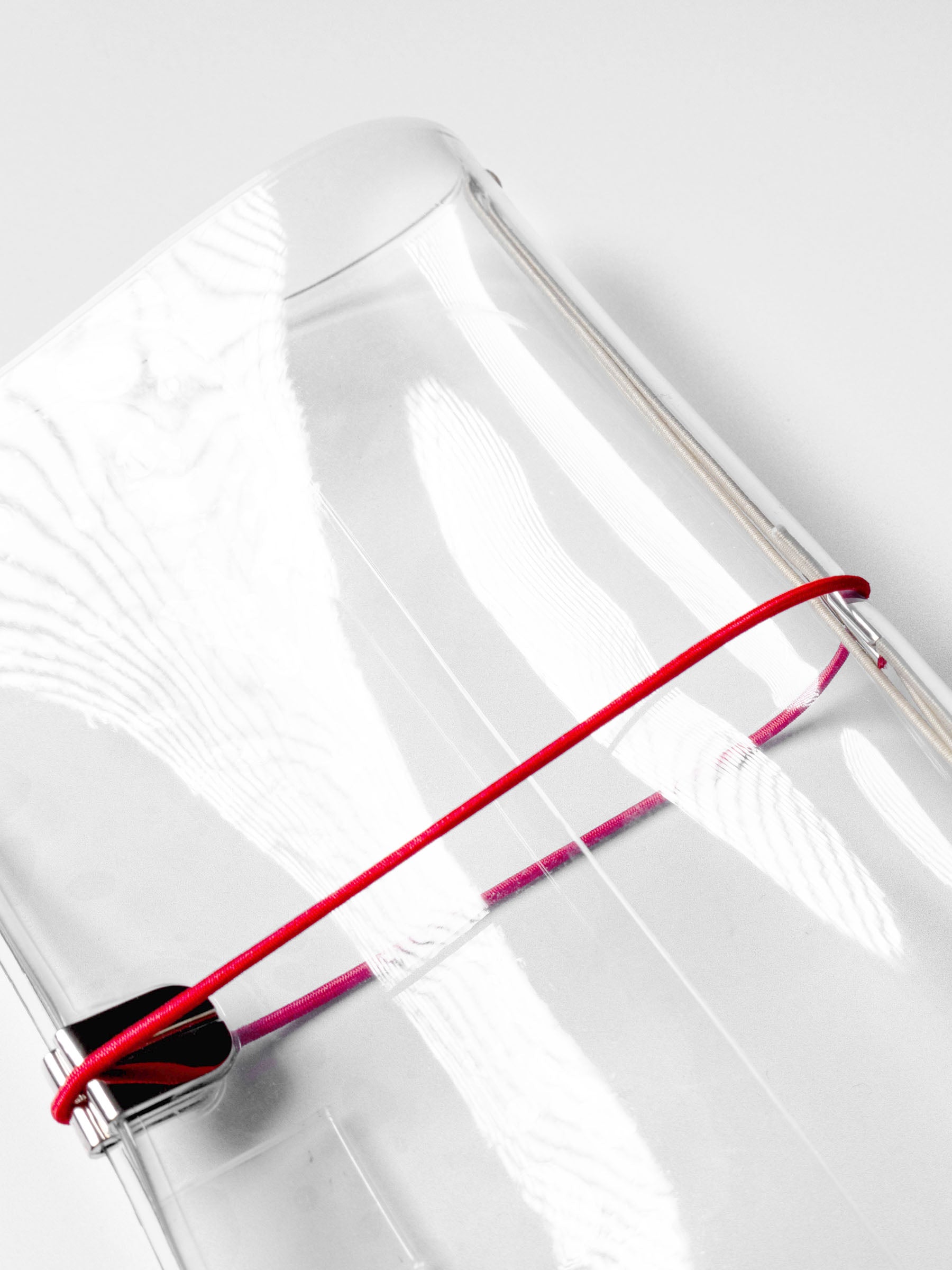 Red cover band in use on an A5 clear cover.