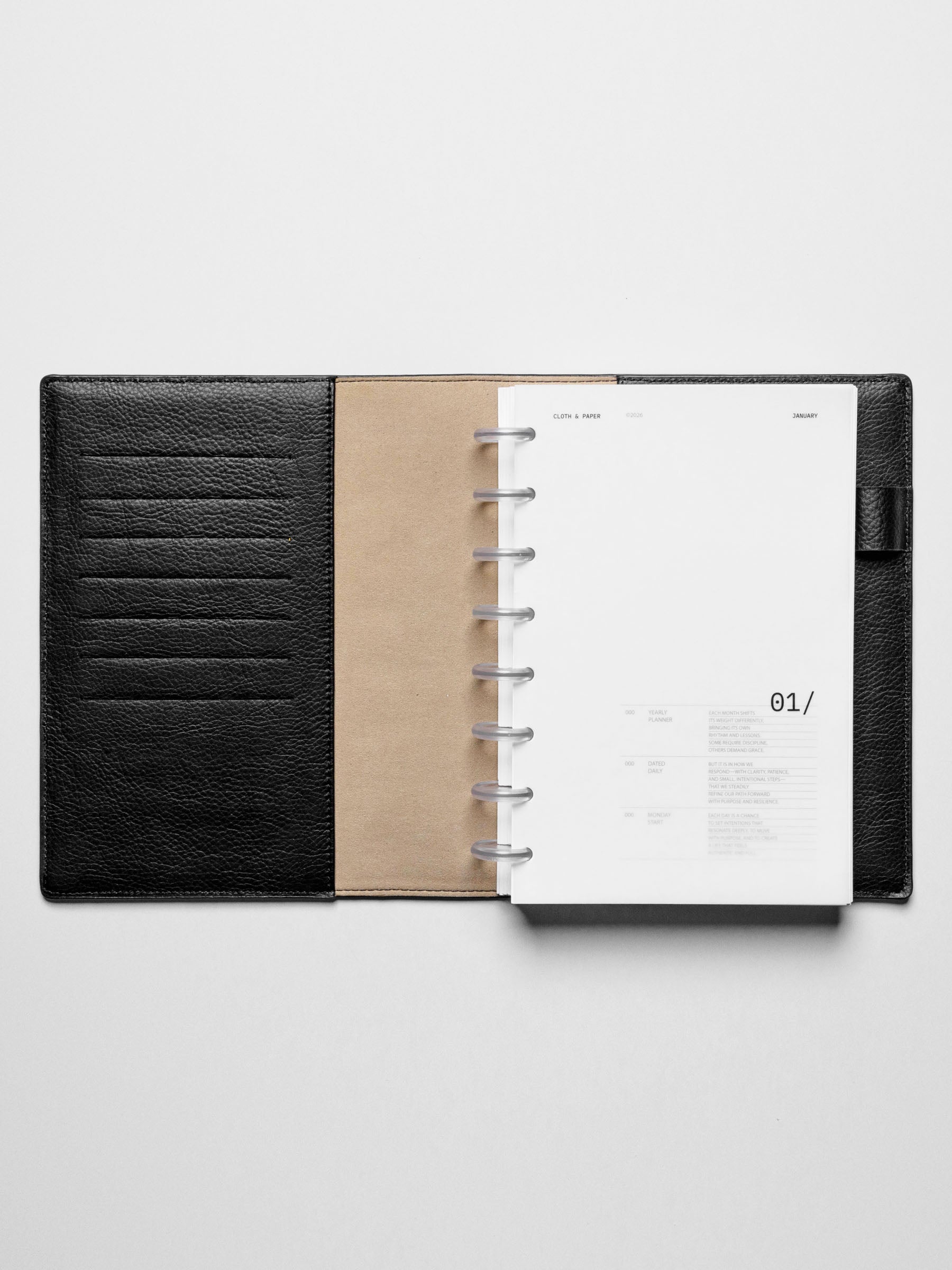 Image shows the January dashboard used in a black leather Half Letter disc-bound planner.