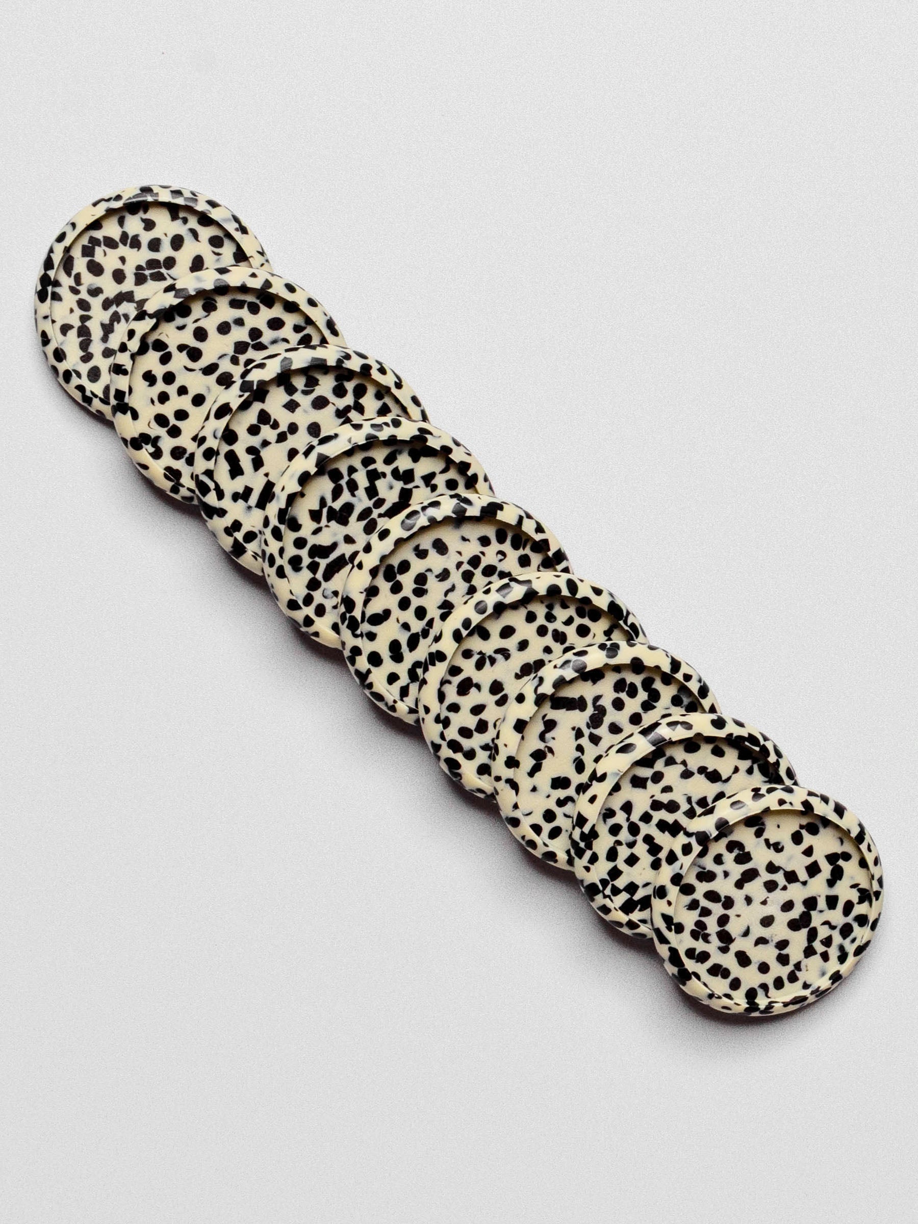 Set of nine discs displayed on a neutral background. Size shown is 1.25 inches.