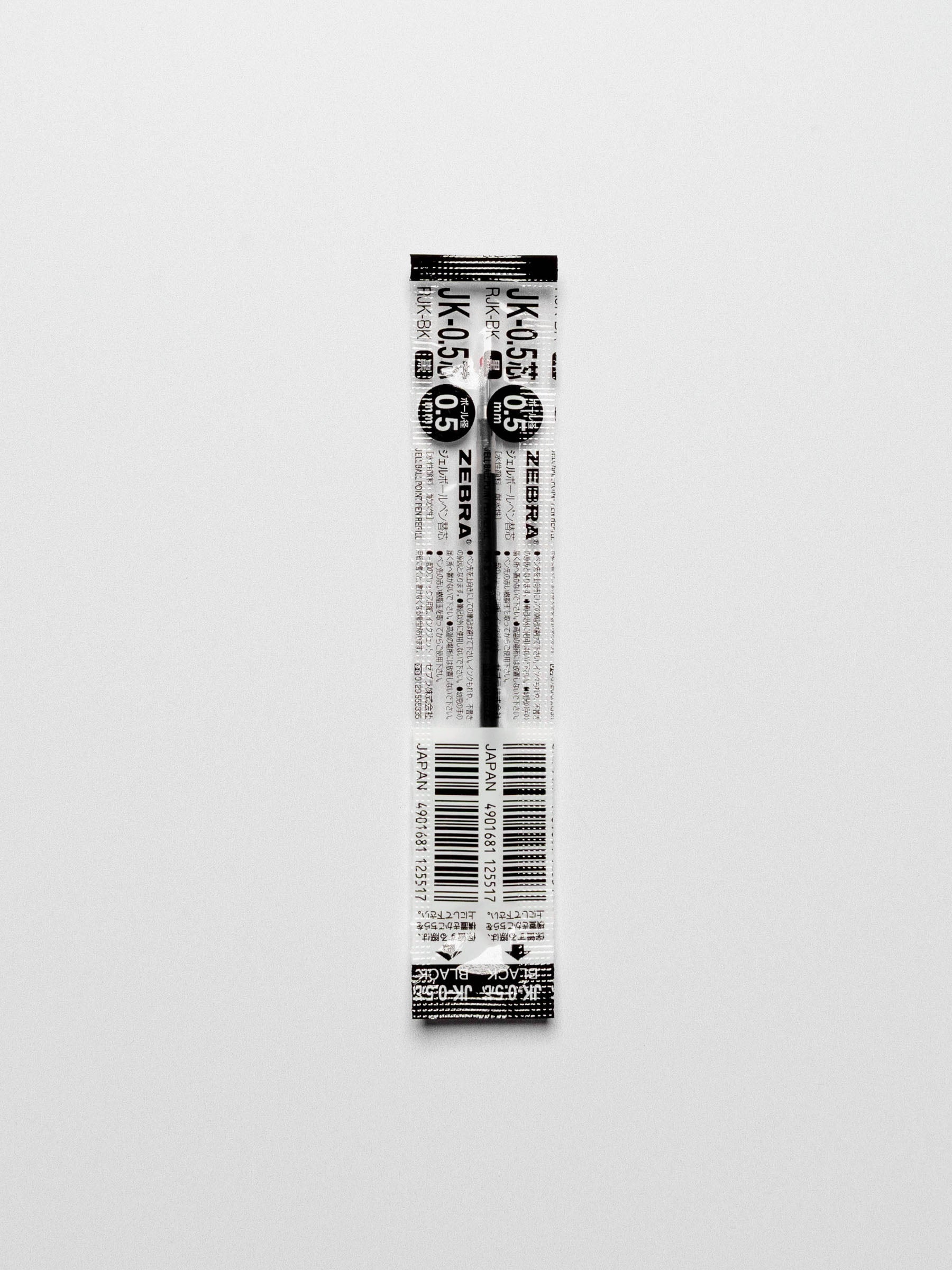 Black 0.5 mm refill shown on a neutral background.
