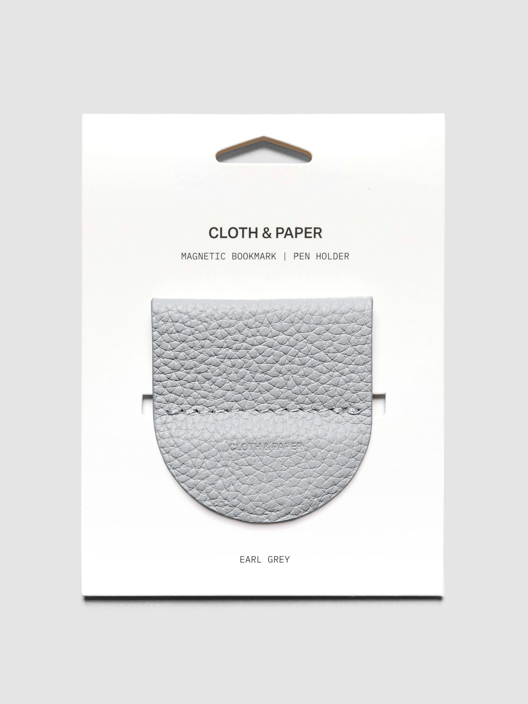 Magnetic Bookmark | Pen Holder in color Earl Grey shown on backing card.