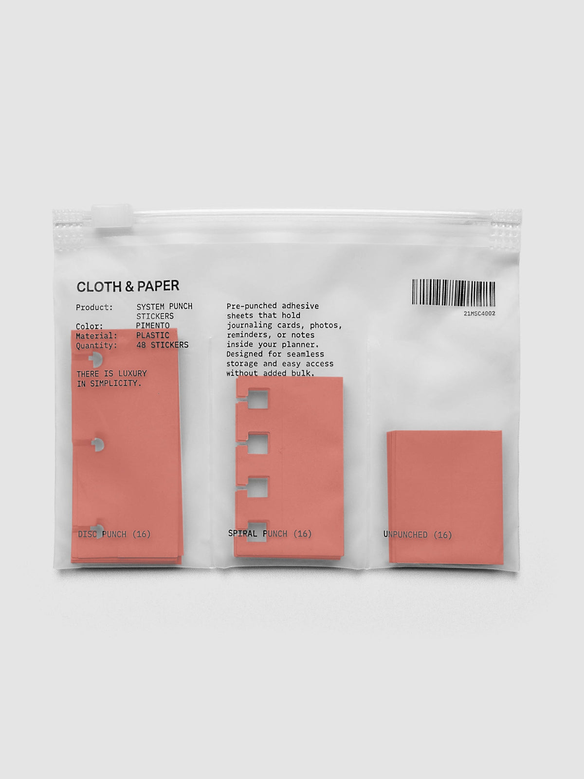 System Punch Stickers in Pimento, disc punch pack with disc punch, spiral punch and unpunched adhesive stickers in a zip bag