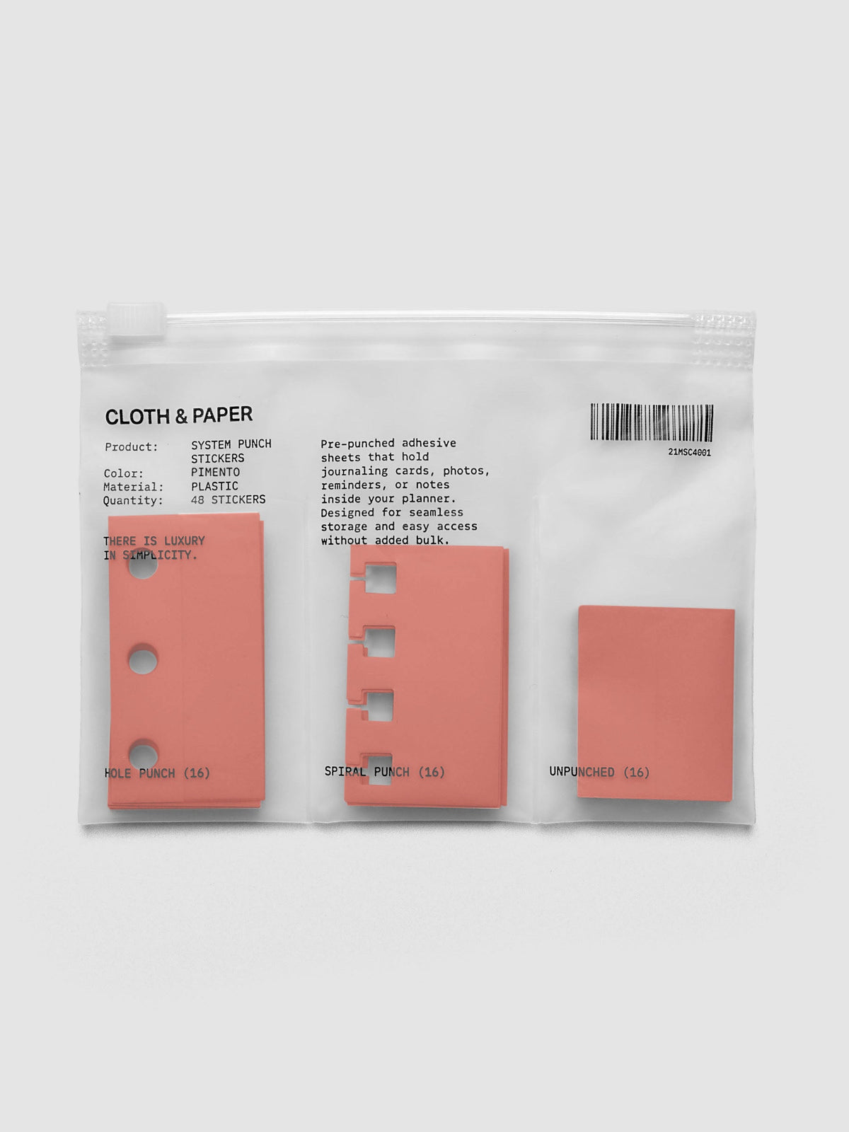 System Punch Stickers in Pimento, ring punch pack with hole punch, spiral punch and unpunched adhesive stickers in a zip bag