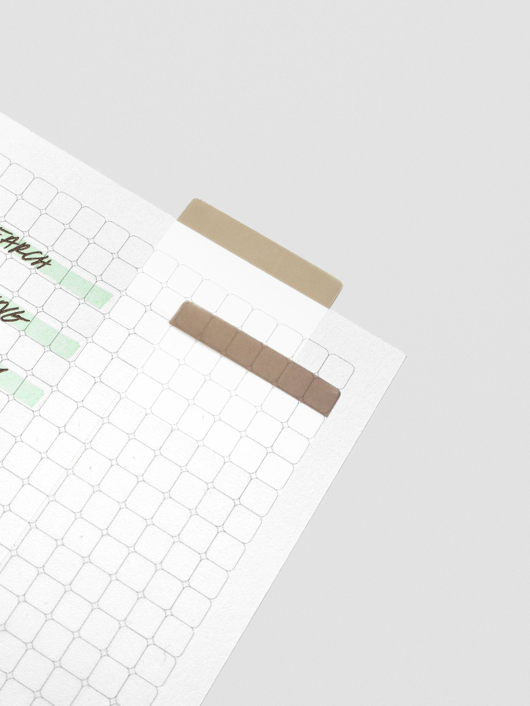 One of each color of extended transparent page flags adhered to a rounded graph insert.