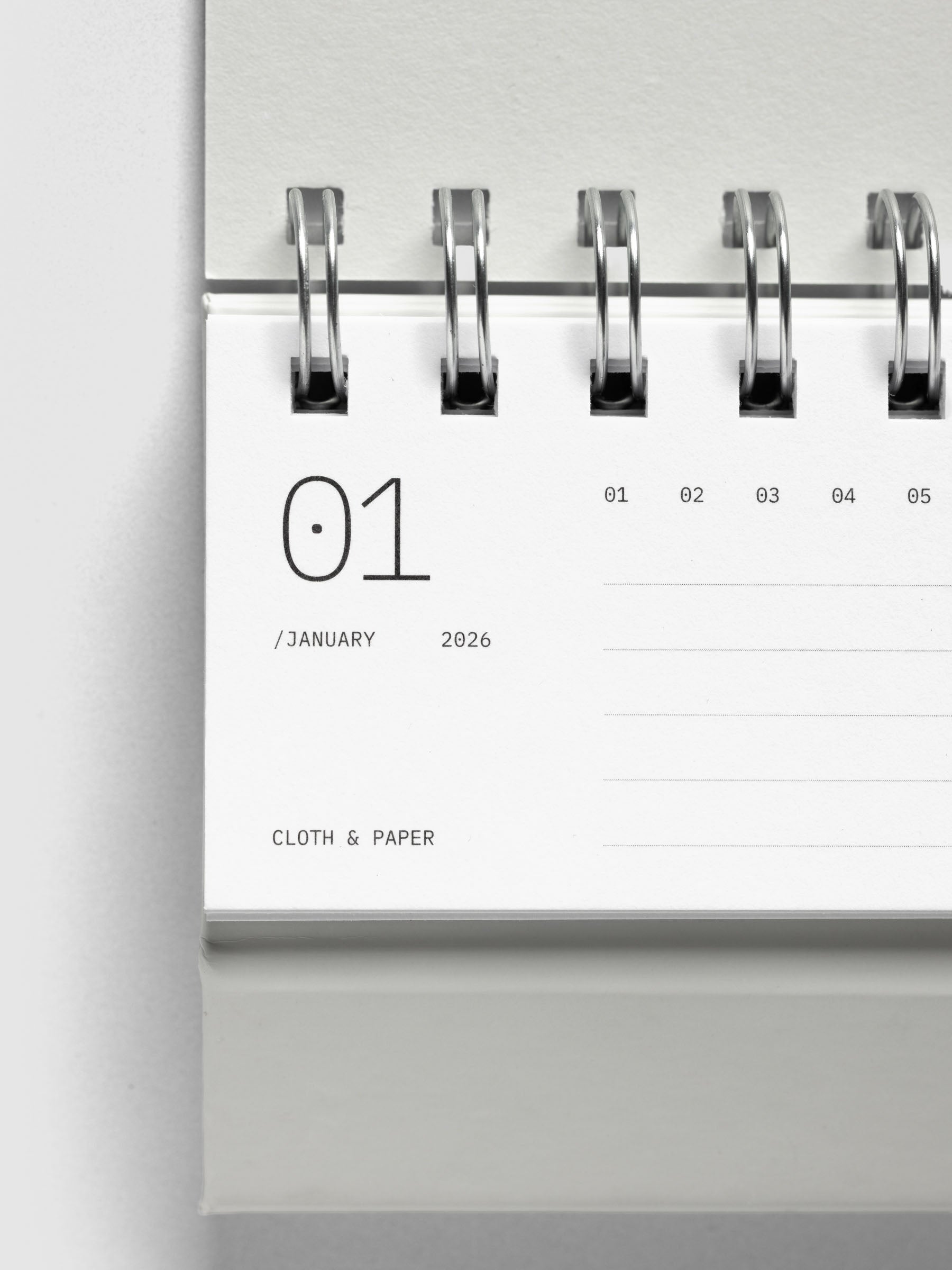 Close up of 2026 Spiral Desk Calendar shown folded and flat, displaying a calendar page.