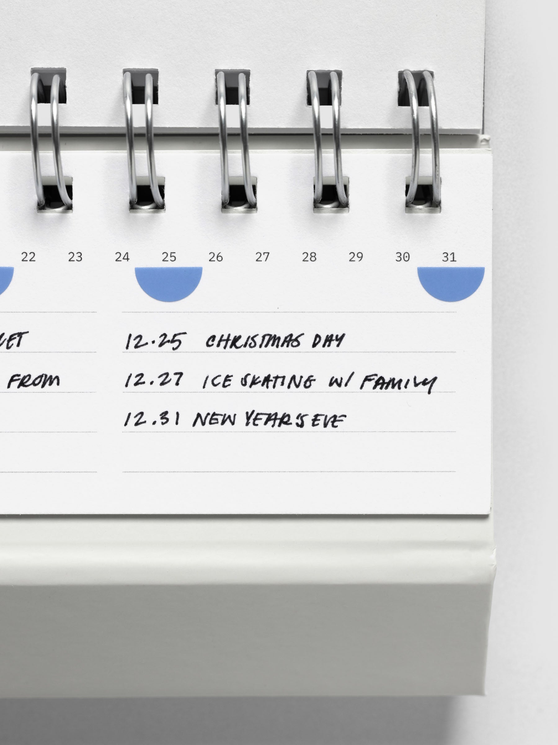 Close up of 2026 Spiral Desk Calendar shown folded and flat, displaying a calendar page with handwritten notes.