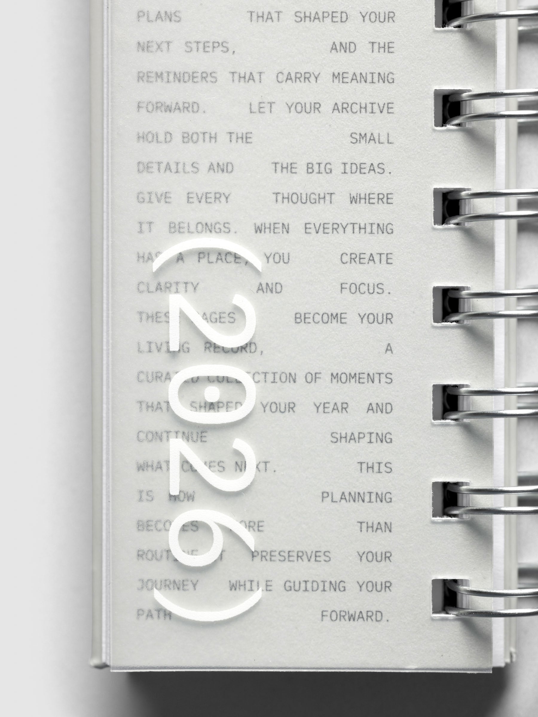 Close up of exterior of 2026 Spiral Desk Calendar displaying 2026 text.