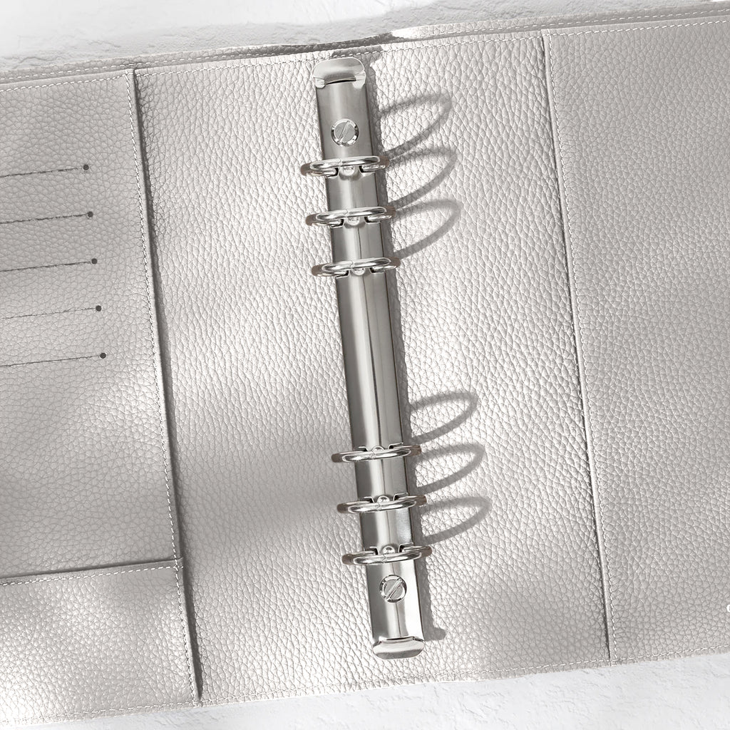 Closeup of silver hardware in an Ash leather agenda.