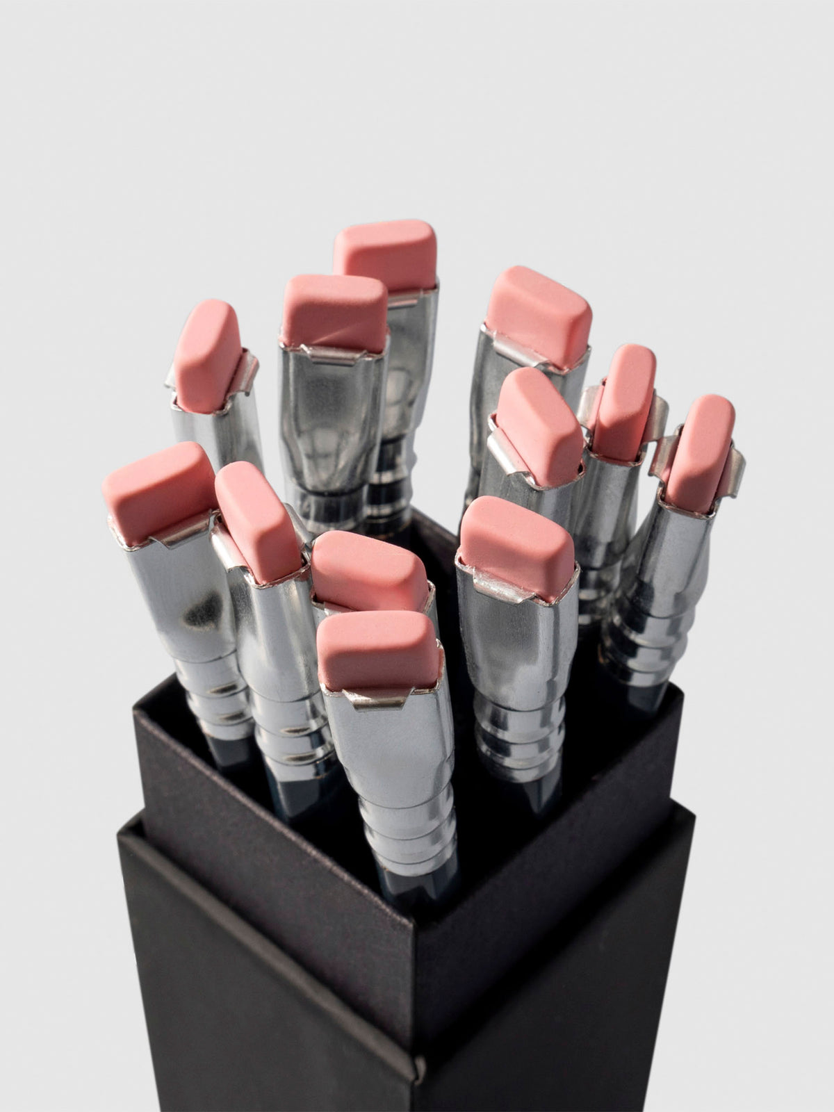 Set of 12 pencils displayed eraser side up inside the pencil packaging.