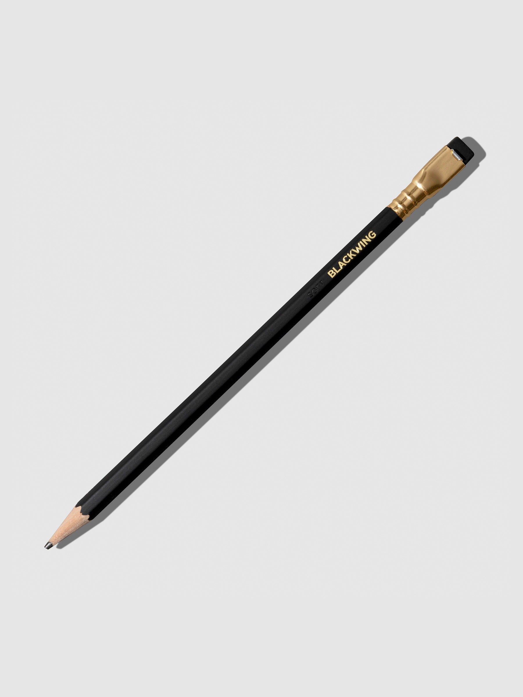 The image shows the blackwing matte pencil. It features a black pencil with a matching tapered eraser set in gold.