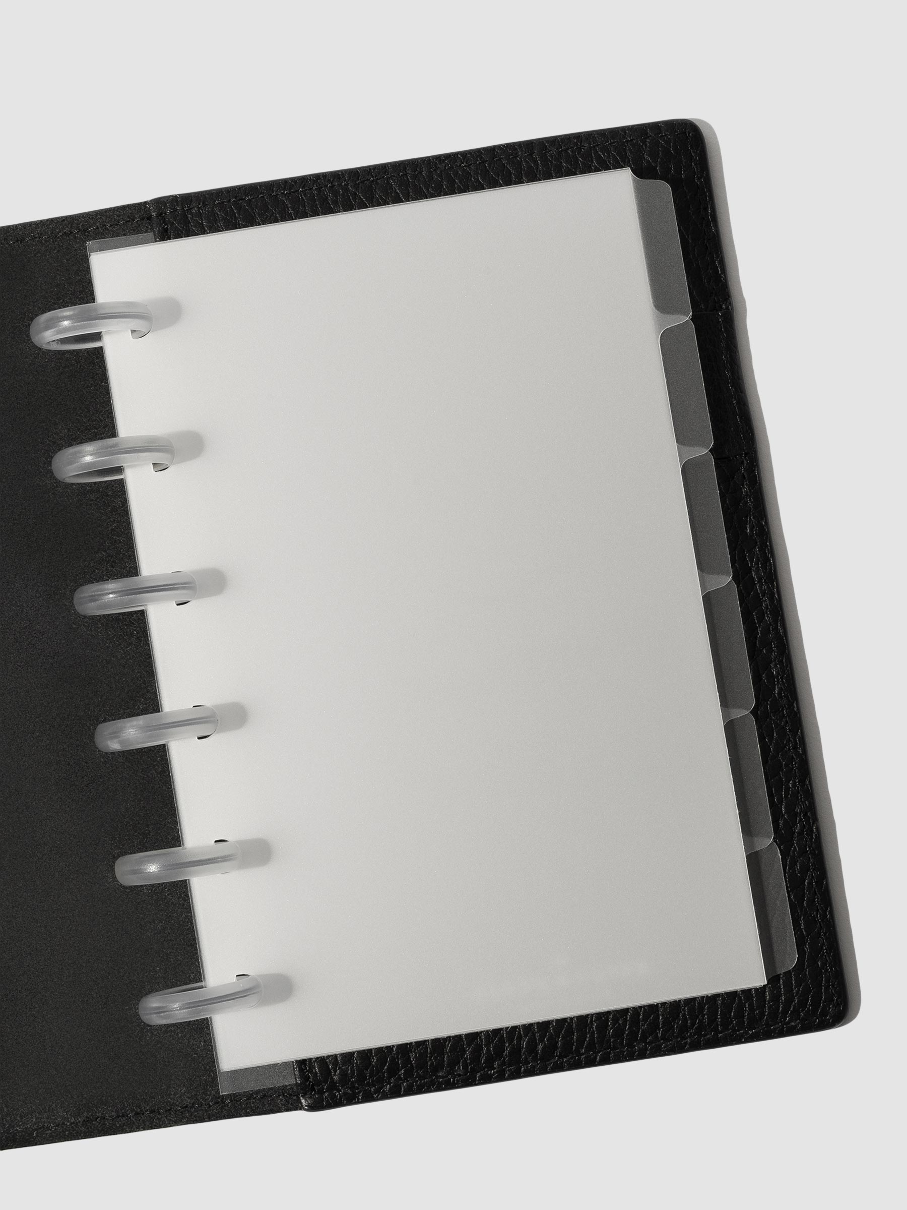 CP Petite Blank side tabs shown in use inside a black leather planner.