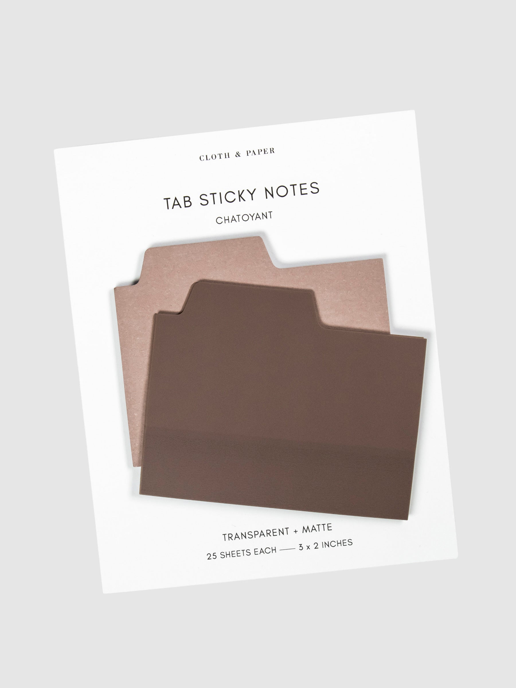 Blank Tab Sticky Note Set, Chatoyant, Cloth and Paper. Sticky note set displayed against a neutral background. The matte sticky note pad is attached to the sticky note backing, while the transparent sticky note pad is layered on top of it, turned slightly to the right.