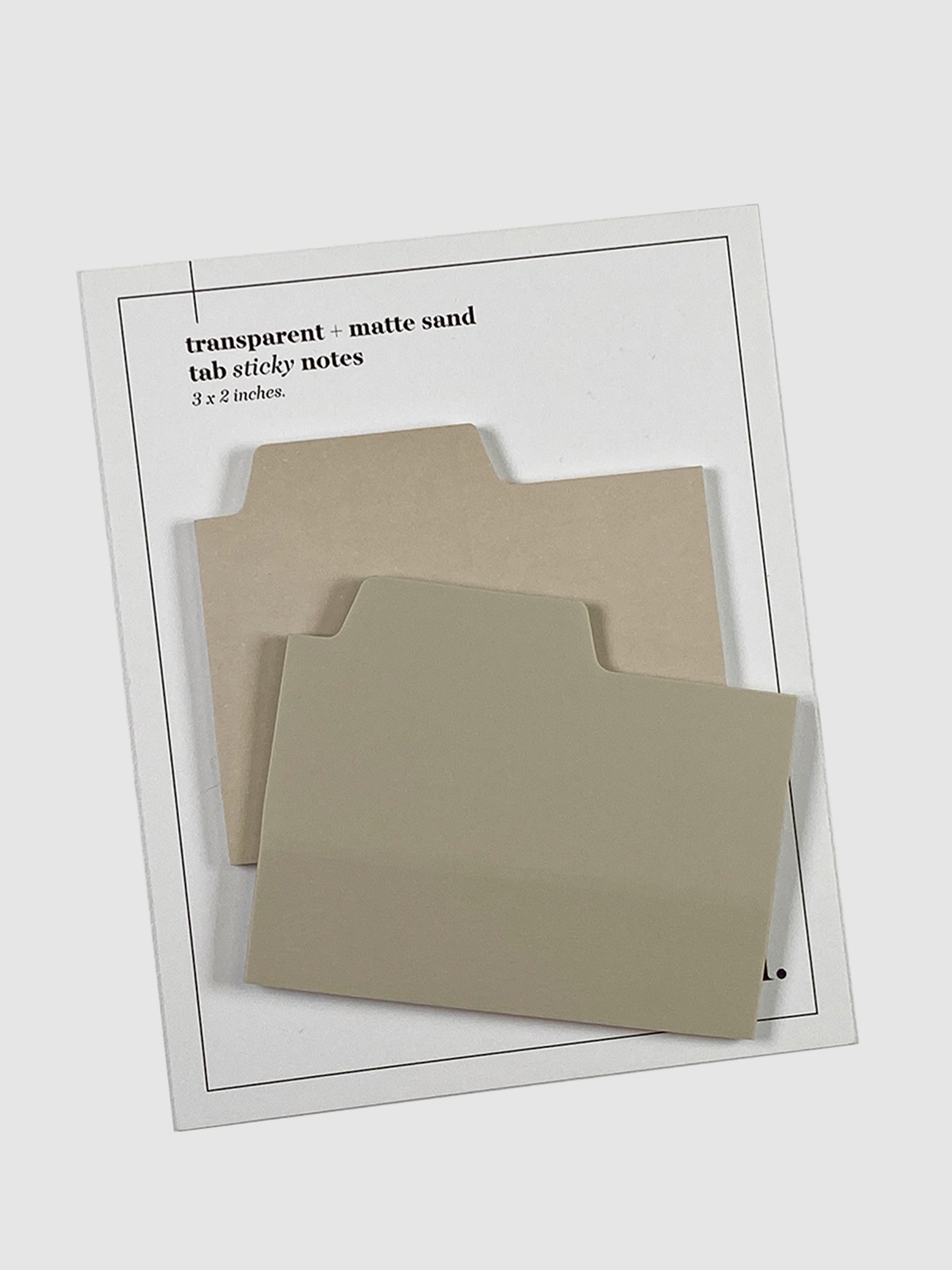 Blank Tab Sticky Note Set, Sand, Cloth and Paper. Sticky note set displayed against a neutral background. The matte sticky note pad is attached to the sticky note backing, while the transparent sticky note pad is layered on top of it, turned slightly to the right.