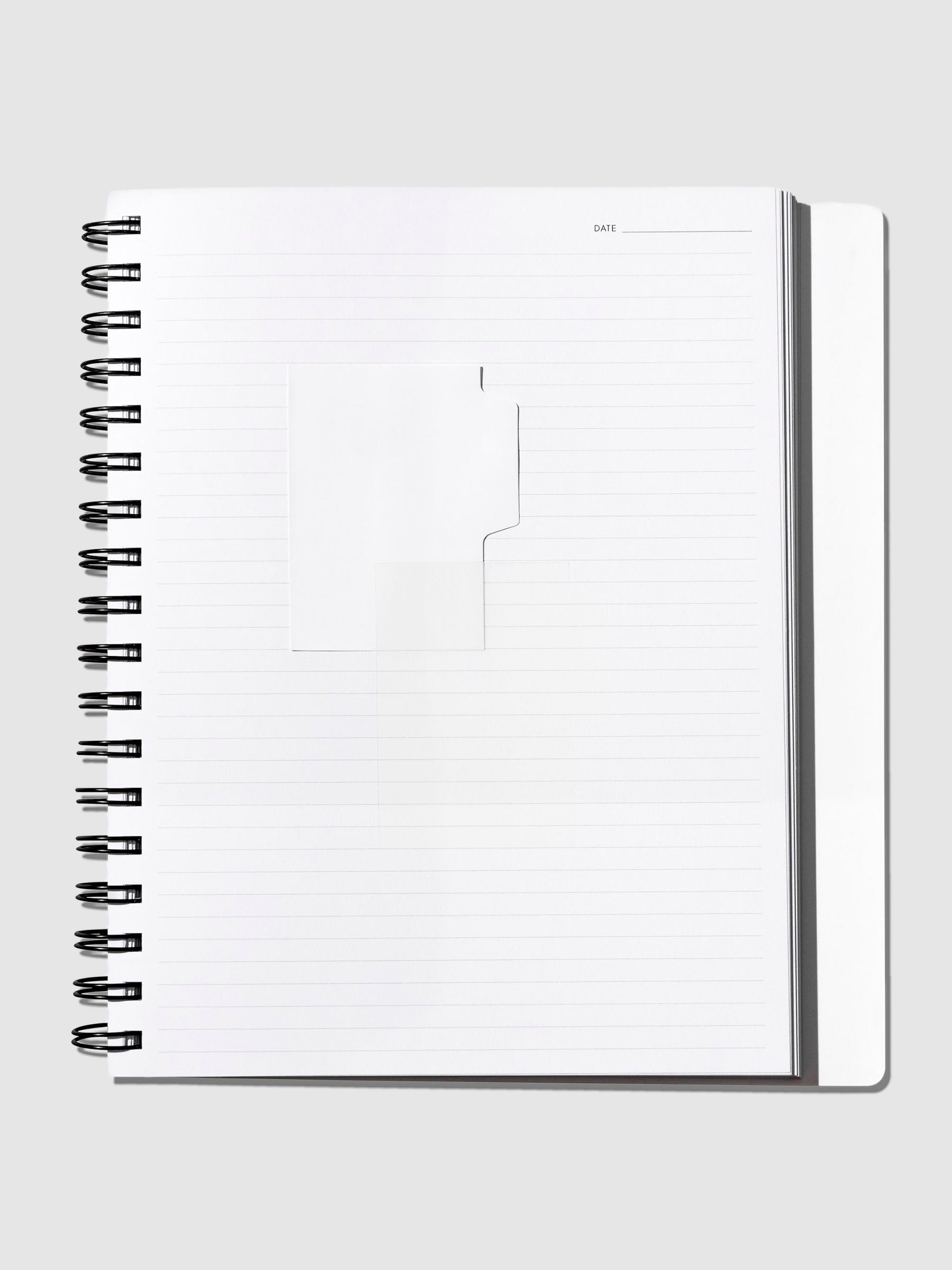 Matte and transparent Blanc sticky note shown inside a notebook on a neutral background.