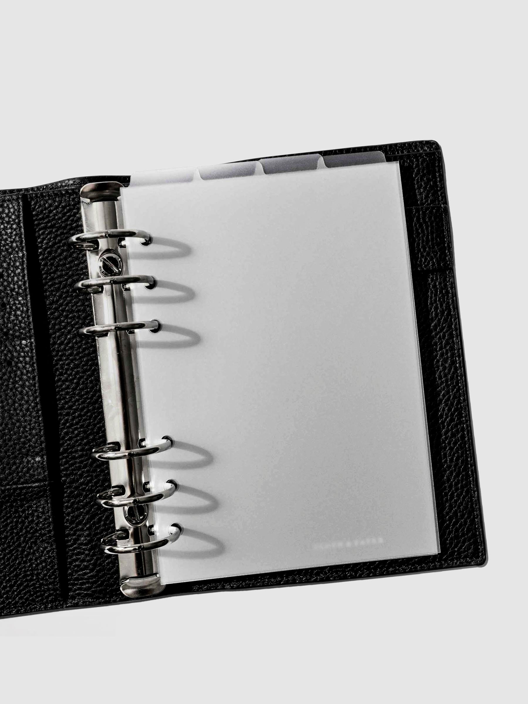 Personal Wide Dividers in use inside a black leather planner.