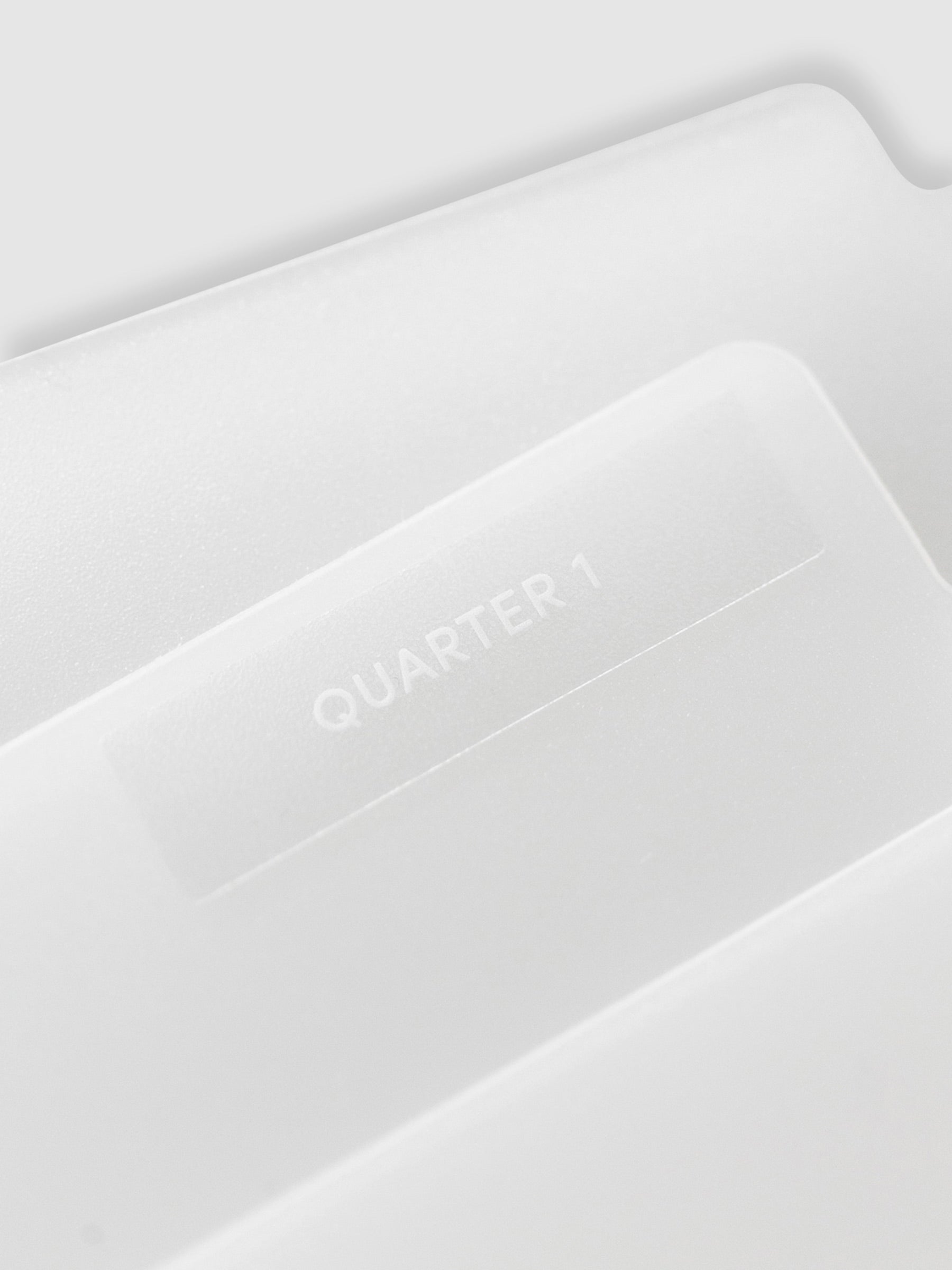 Close up of folder with label reading "Quarter 1." Text is white.