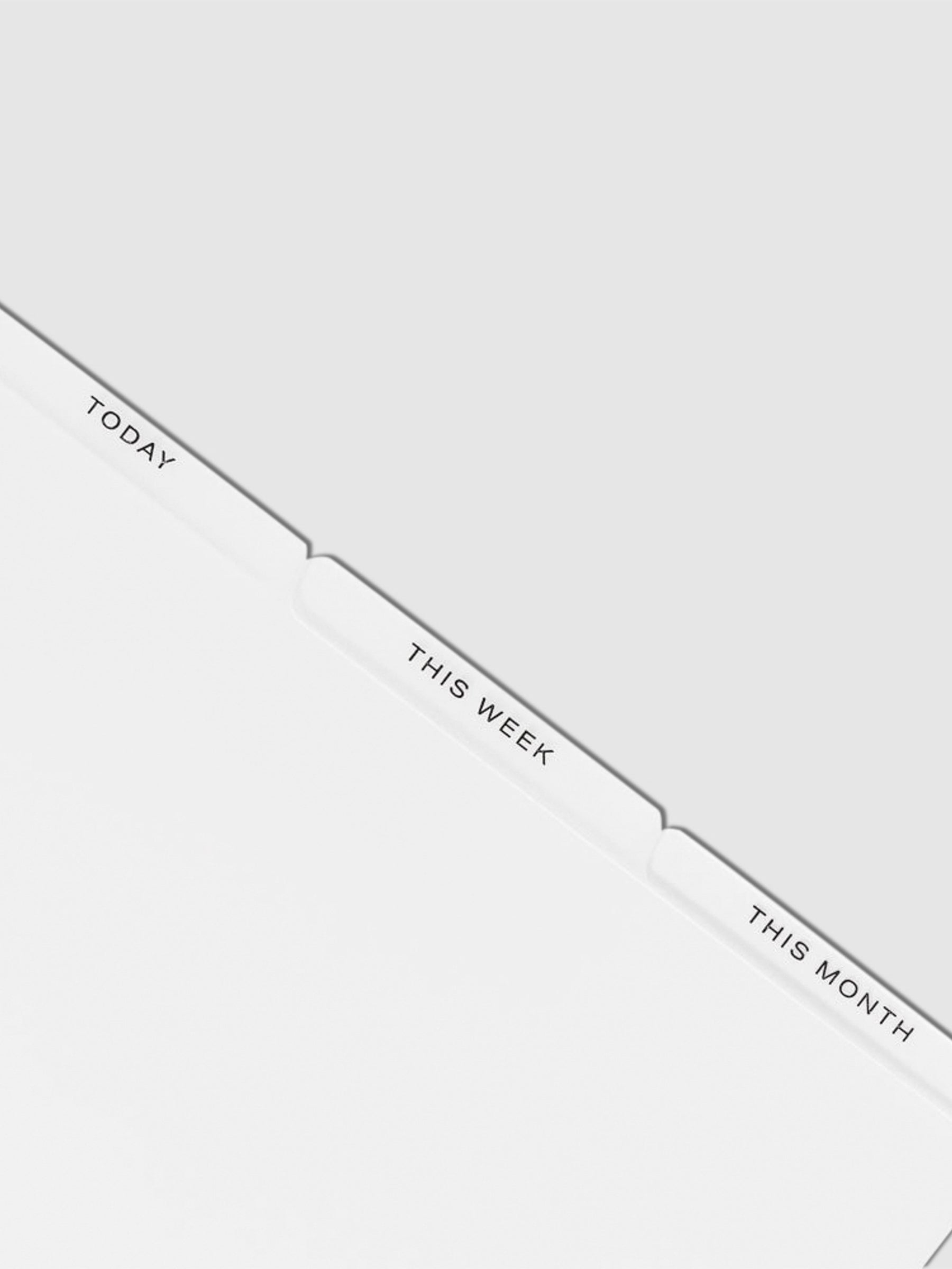 Closeup of black foil dividers on a white background. From left to right, they read Today / This Week / This Month.