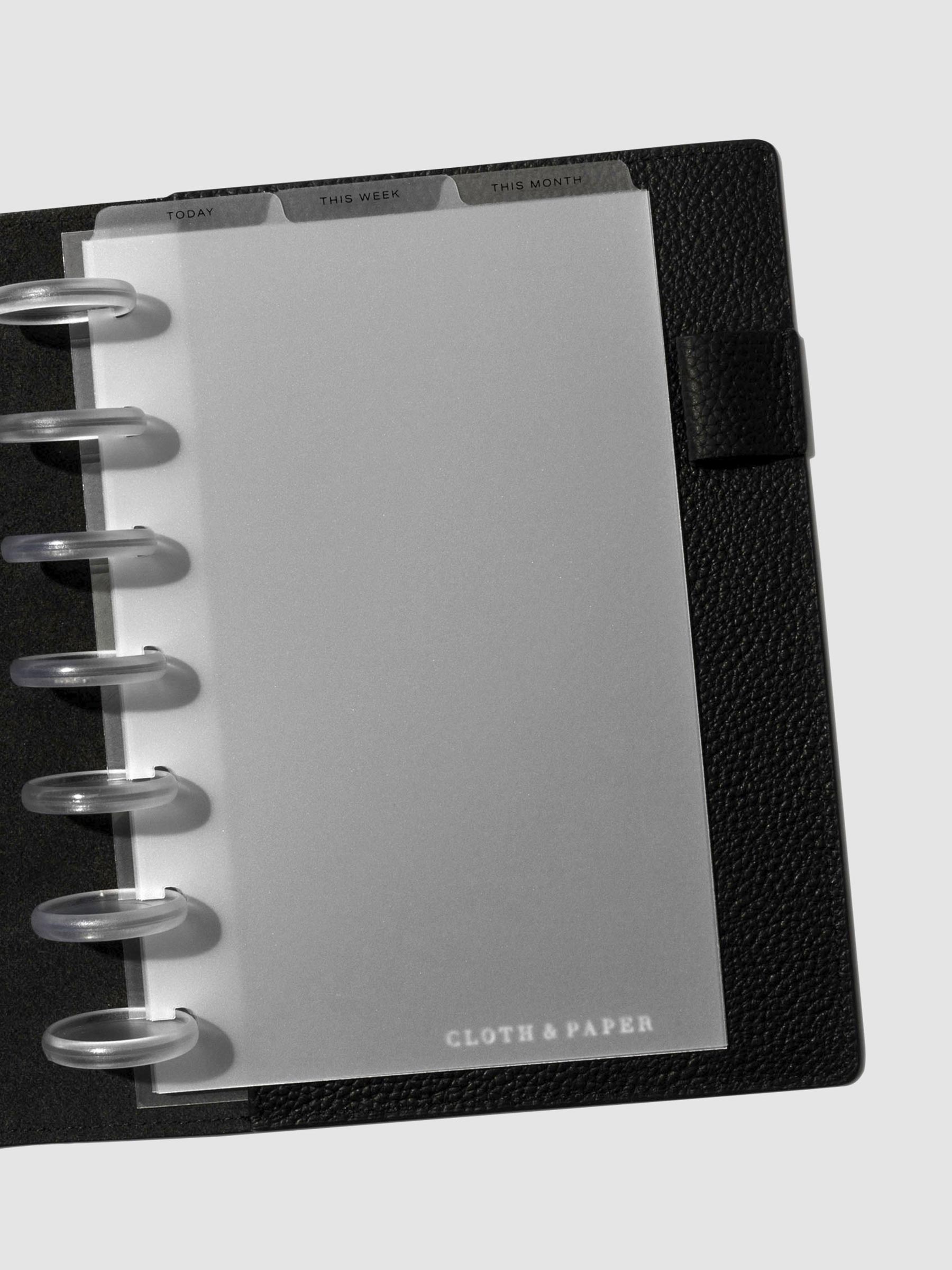 HP Mini Black Foil Cadence Tab Dividers displayed in a black leather planner.