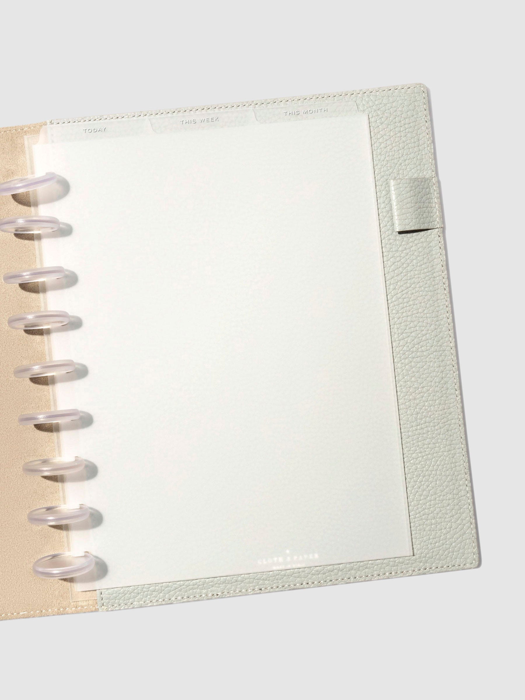 HP Classic White Foil Cadence Tab Dividers displayed in a gray leather planner.
