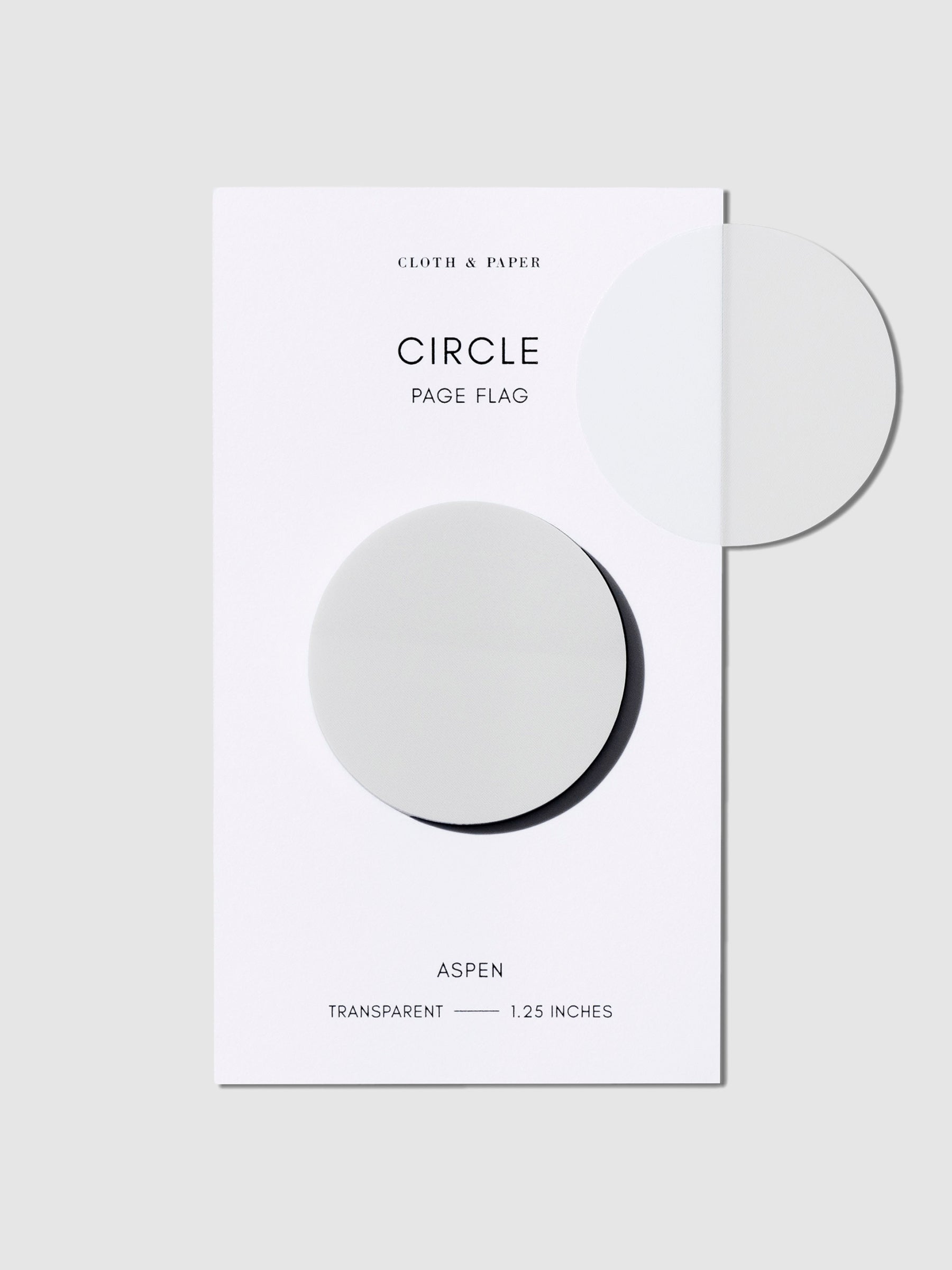 Page flag shown on its backing on a neutral background. One page flag is removed and attached to the packaging to show the page flag's transparent material.