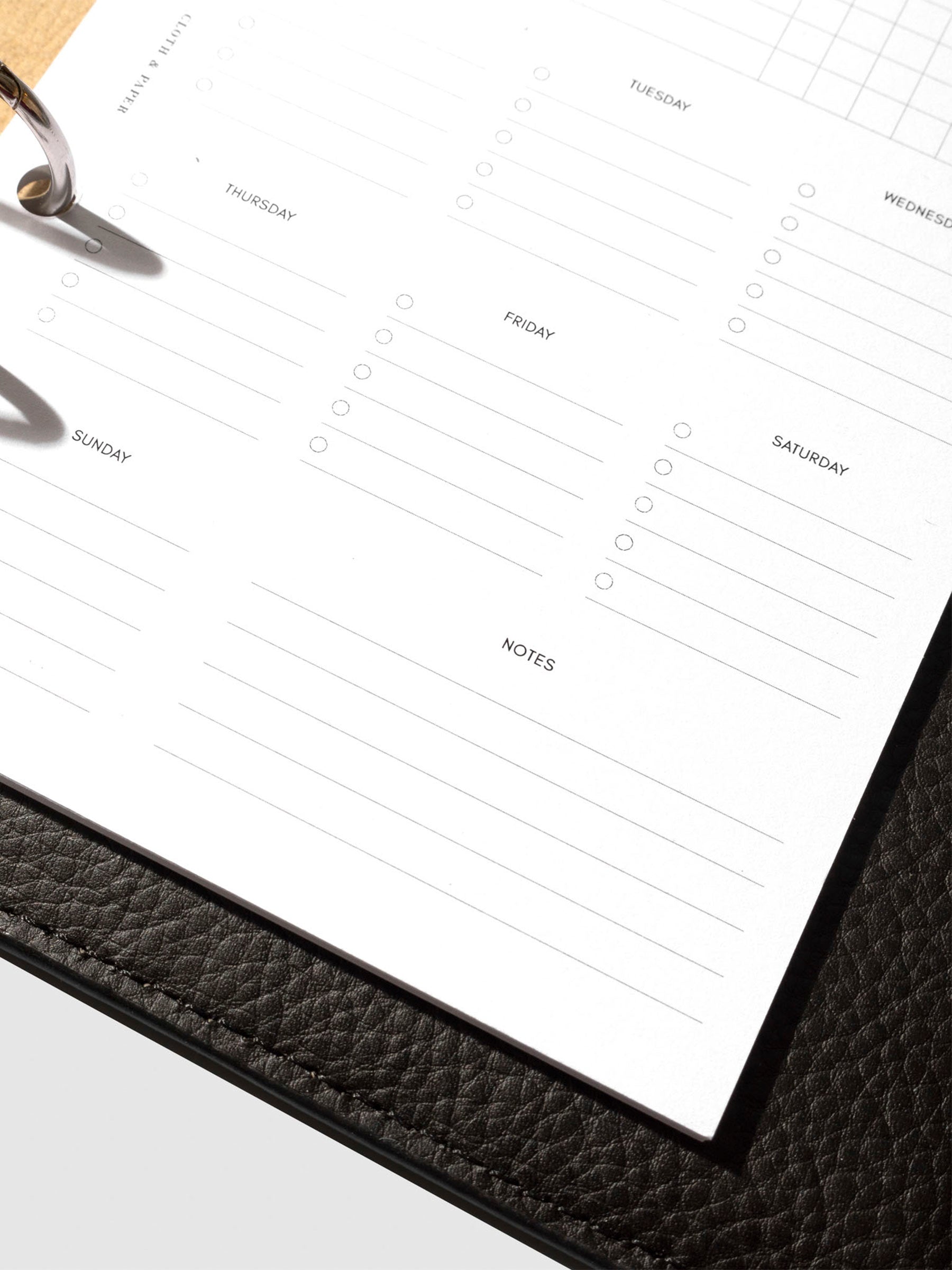 Insert in use inside a black leather planner.