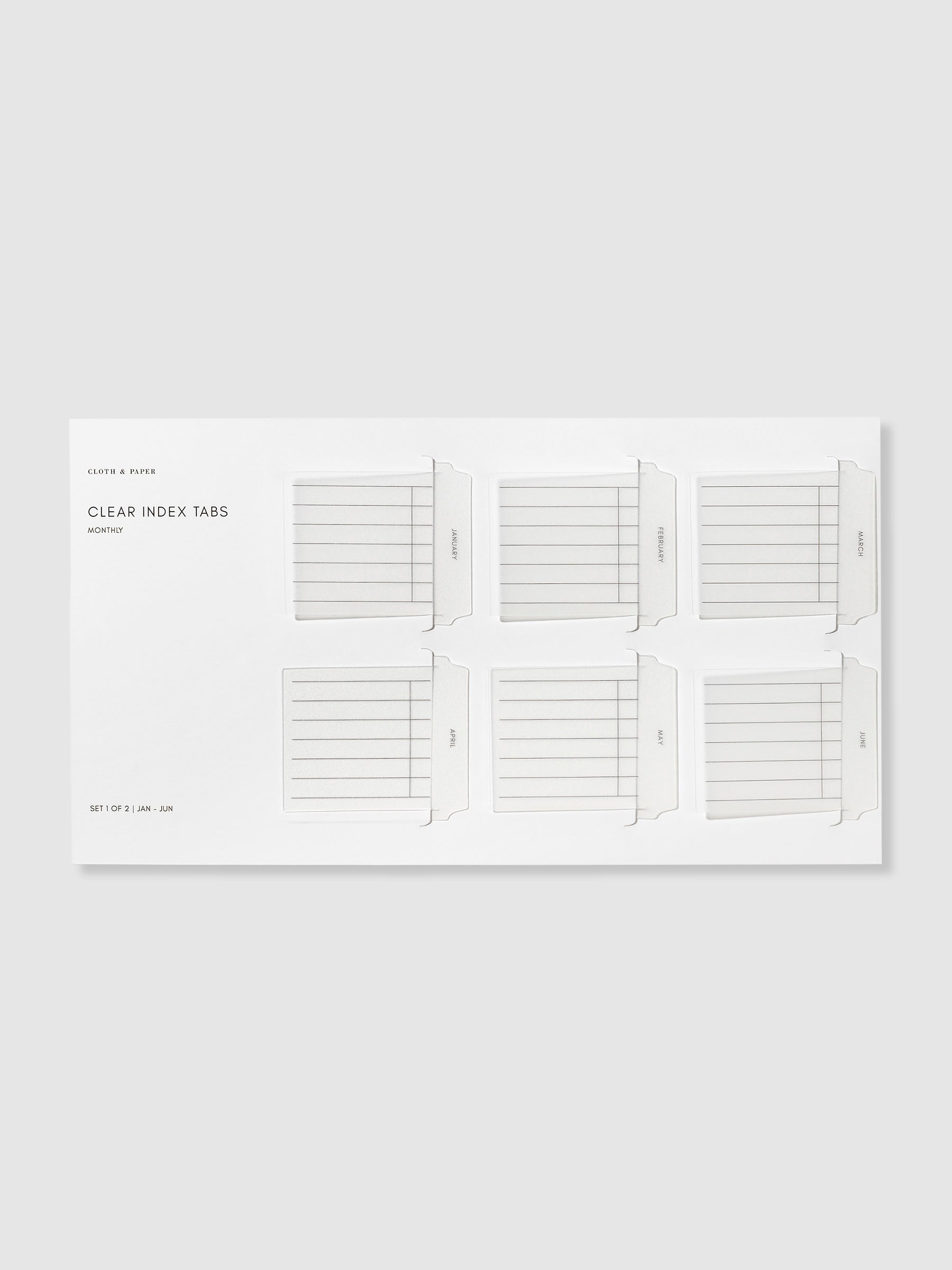 Monthly style Clear Index Tabs in their packaging displayed on a neutral background.
