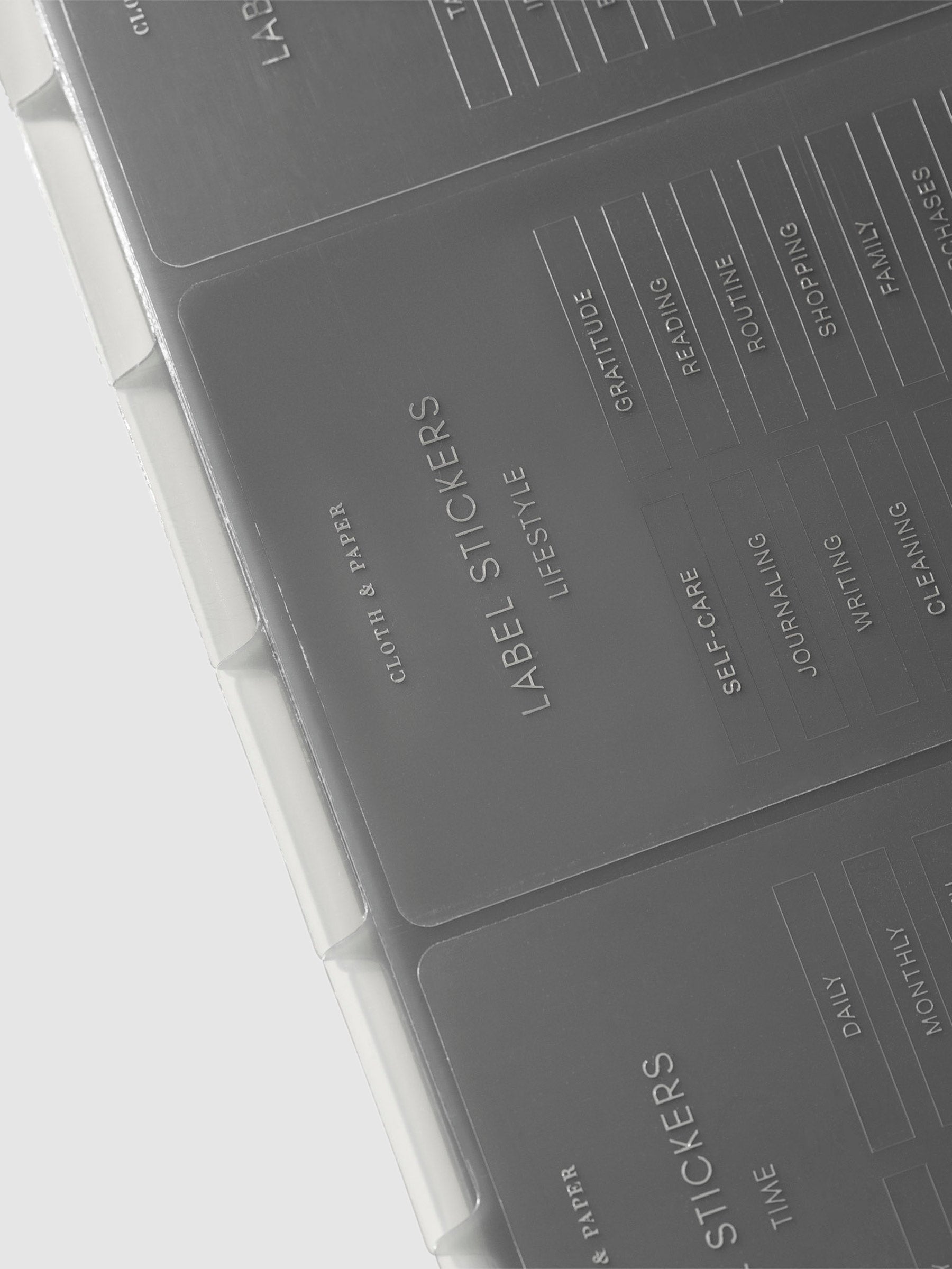 Close up image of the Clear Label Stickers turned to the side at a slight angle, against a neutral background