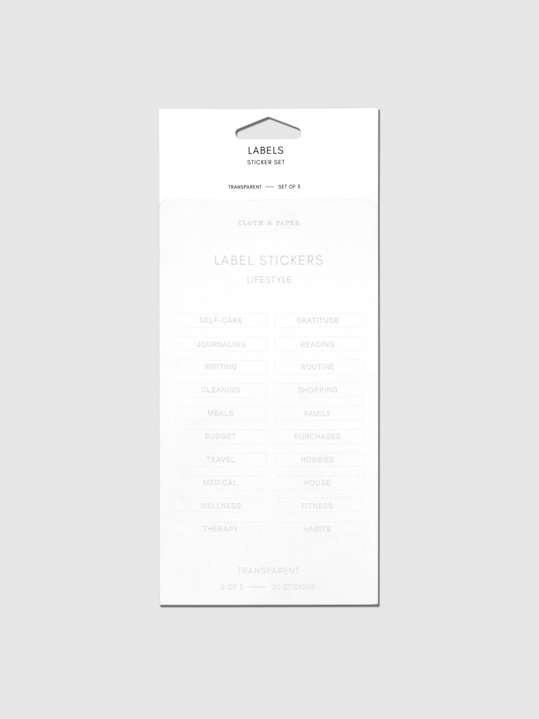 Label stickers in their packaging. The text on each sticker is silver.