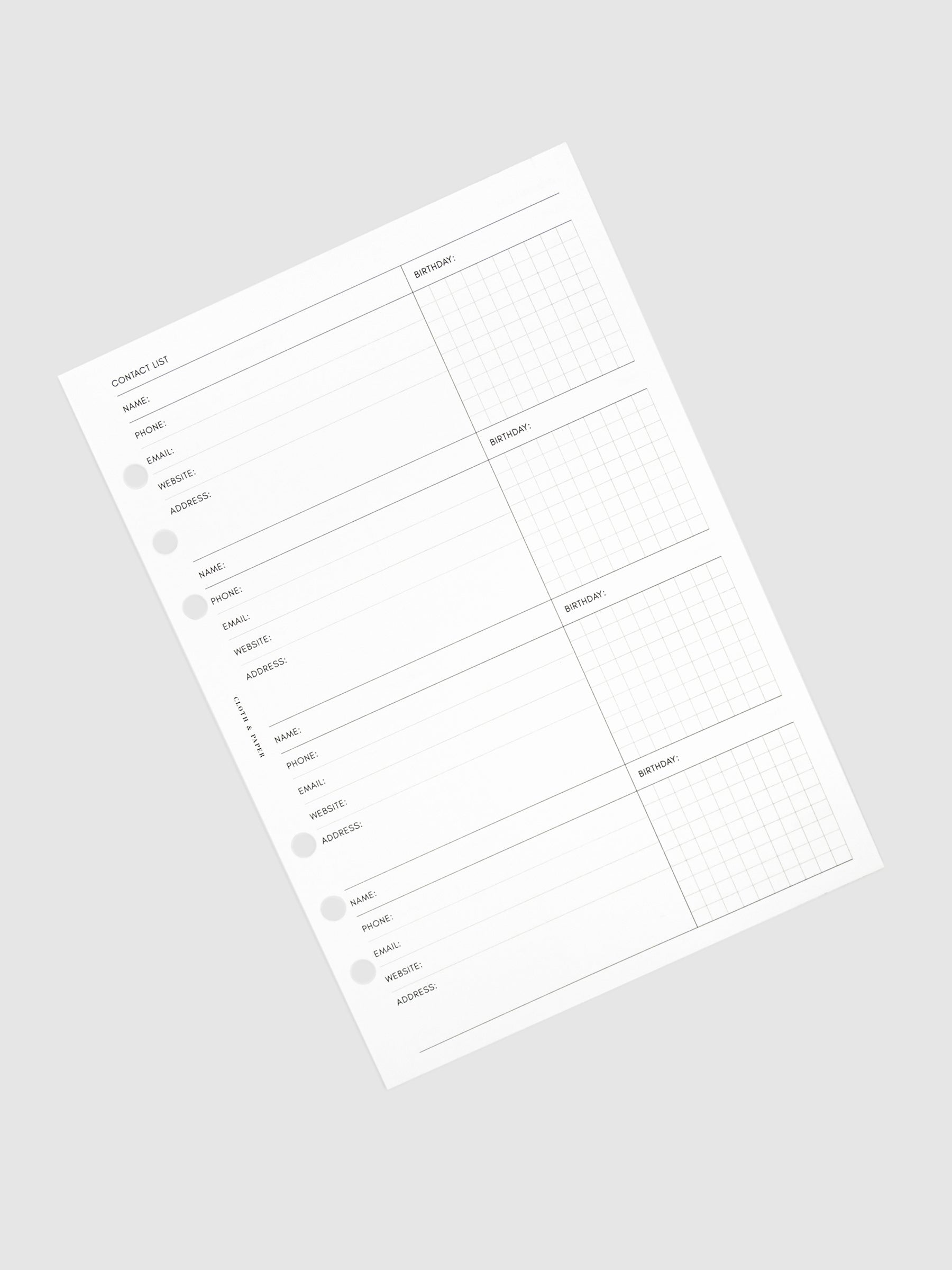 Stack of inserts turned to the left against a neutral background.