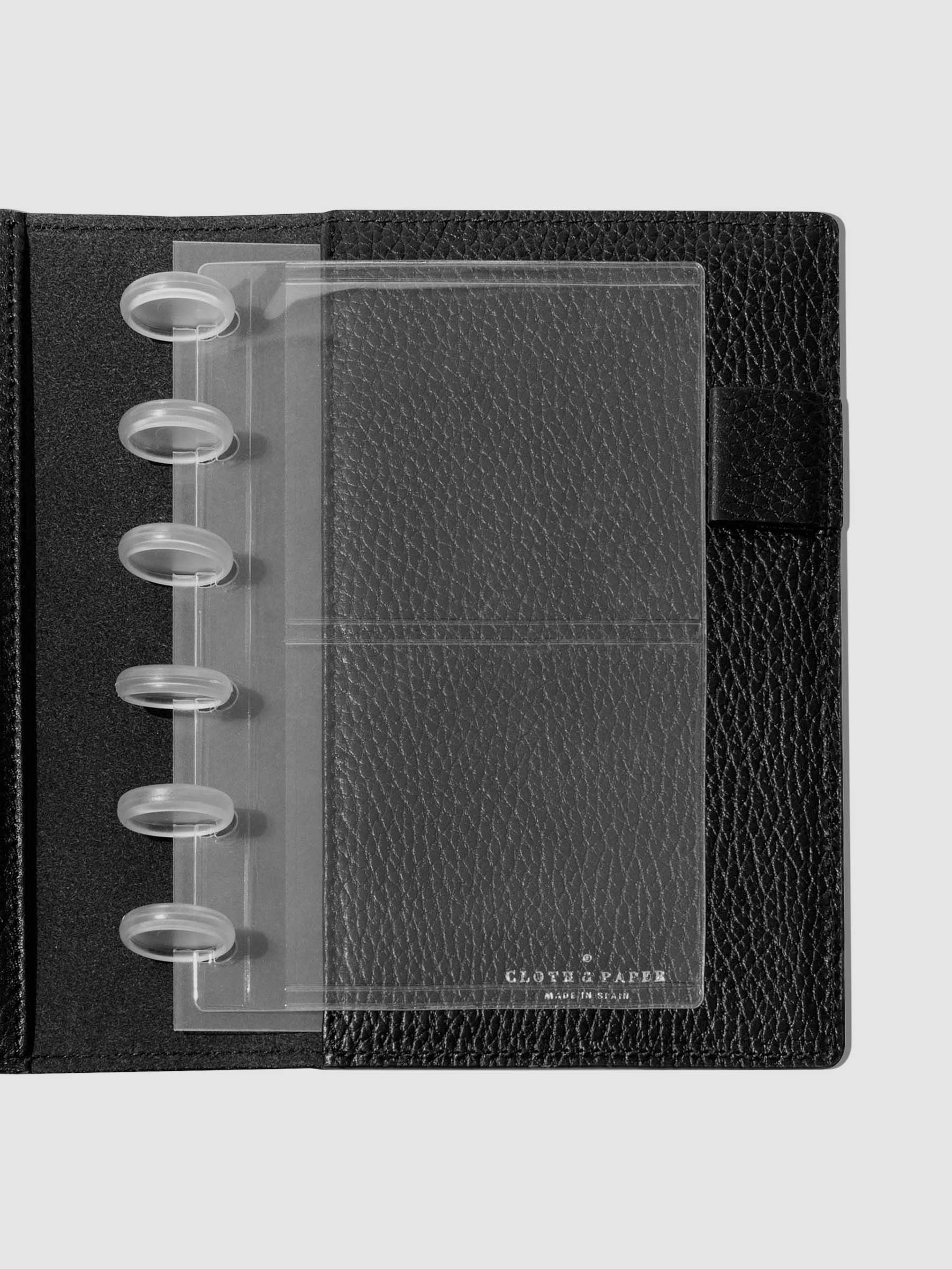 Credit card holders in use inside a black leather folio. Size shown is CP Petite.