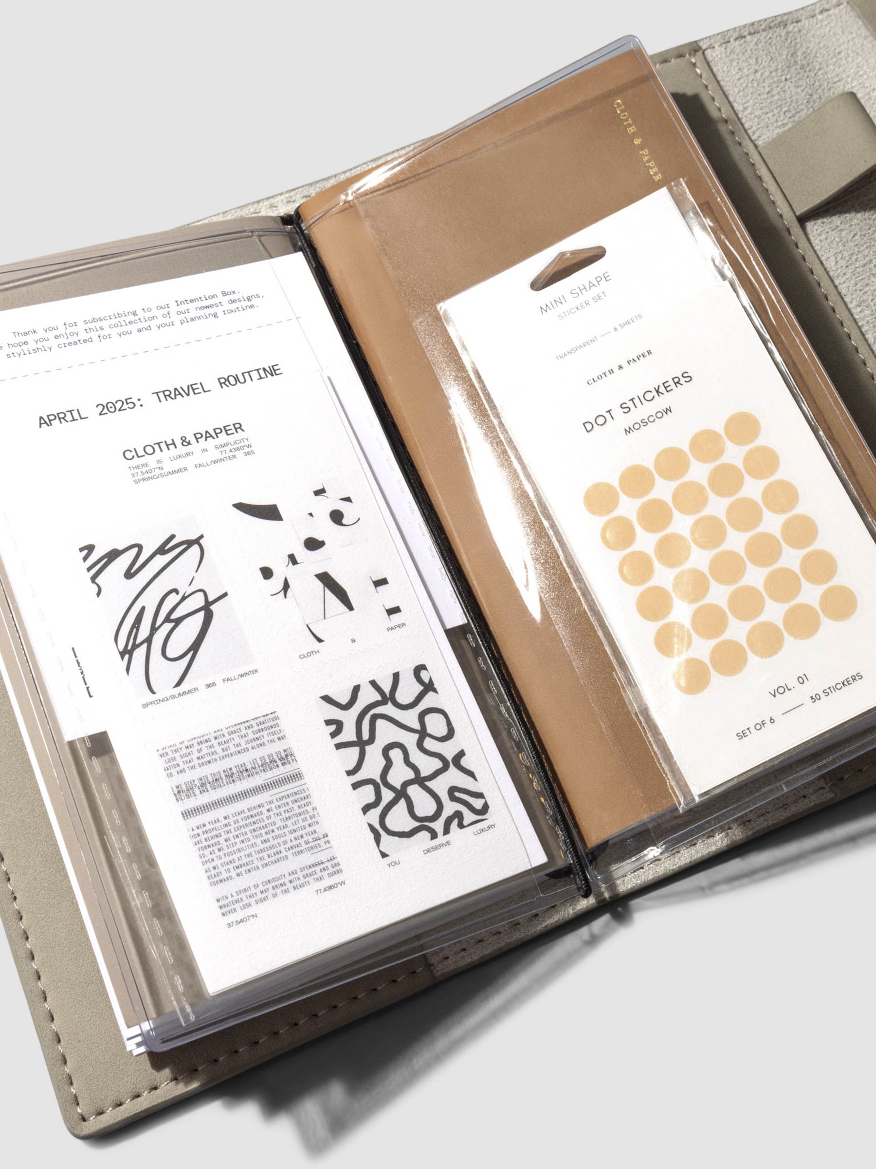 Credit card holder in use inside a Espresso Travel Refillable Notebook Cover. It is filled with dot stickers and two journaling cards.