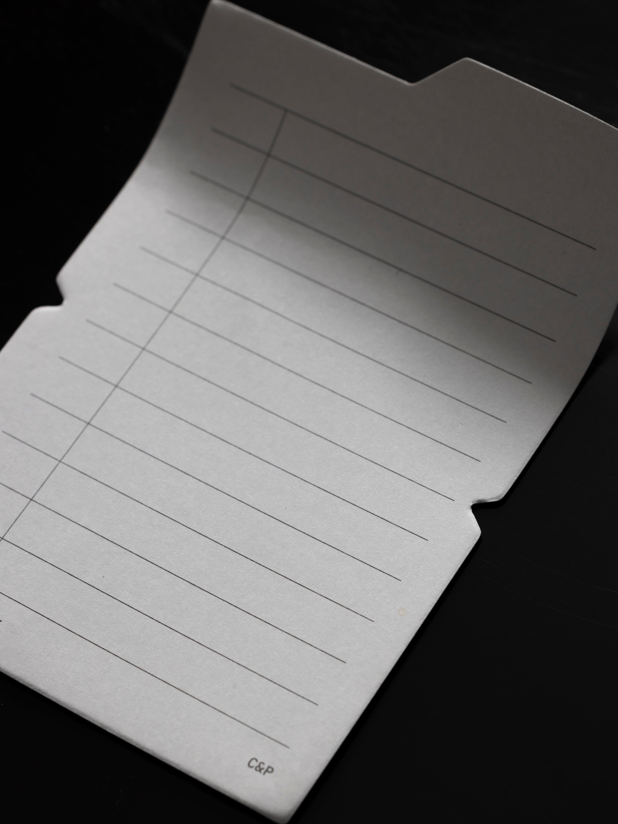 Task Folding Sticky Notes against a black background.