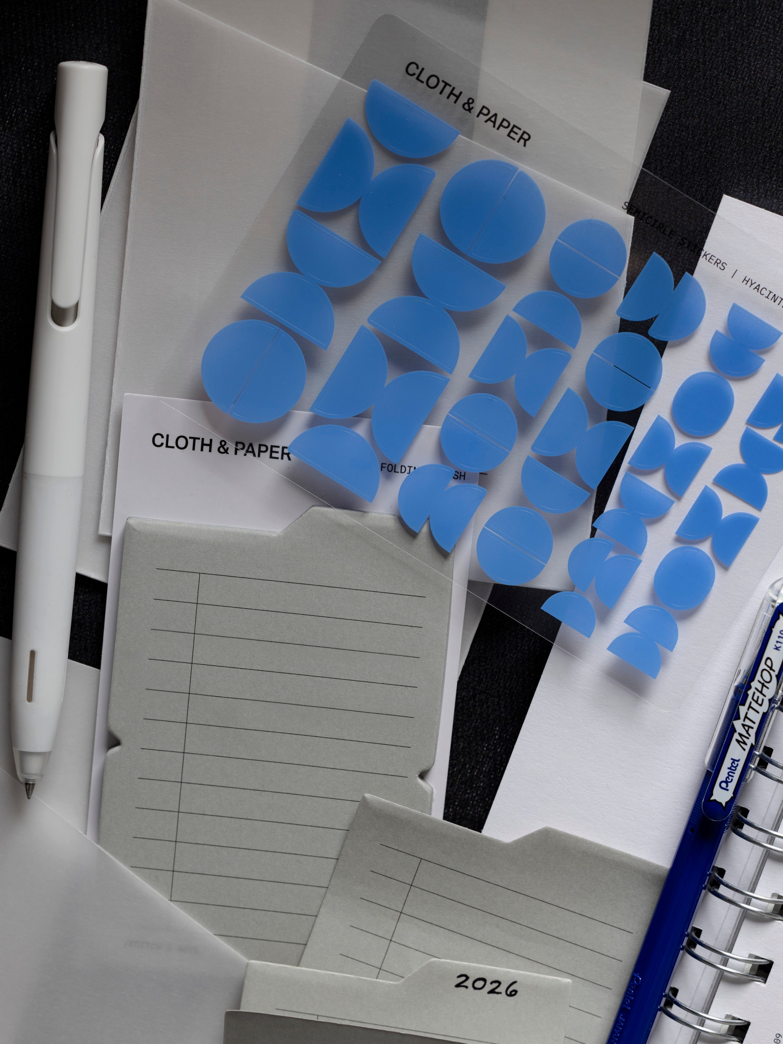 Blue stickers, folding sticking notes, and other accessories included in the December 2025 Intention Box.