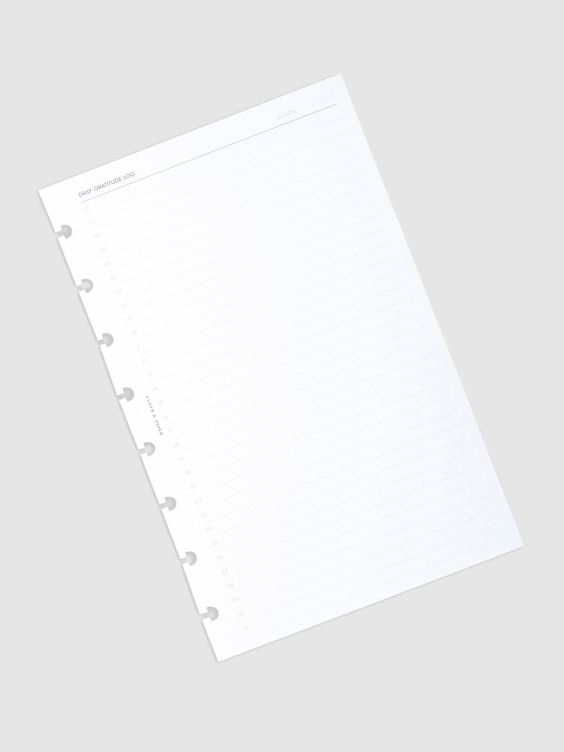 Stack of inserts turned to the left against a neutral background.