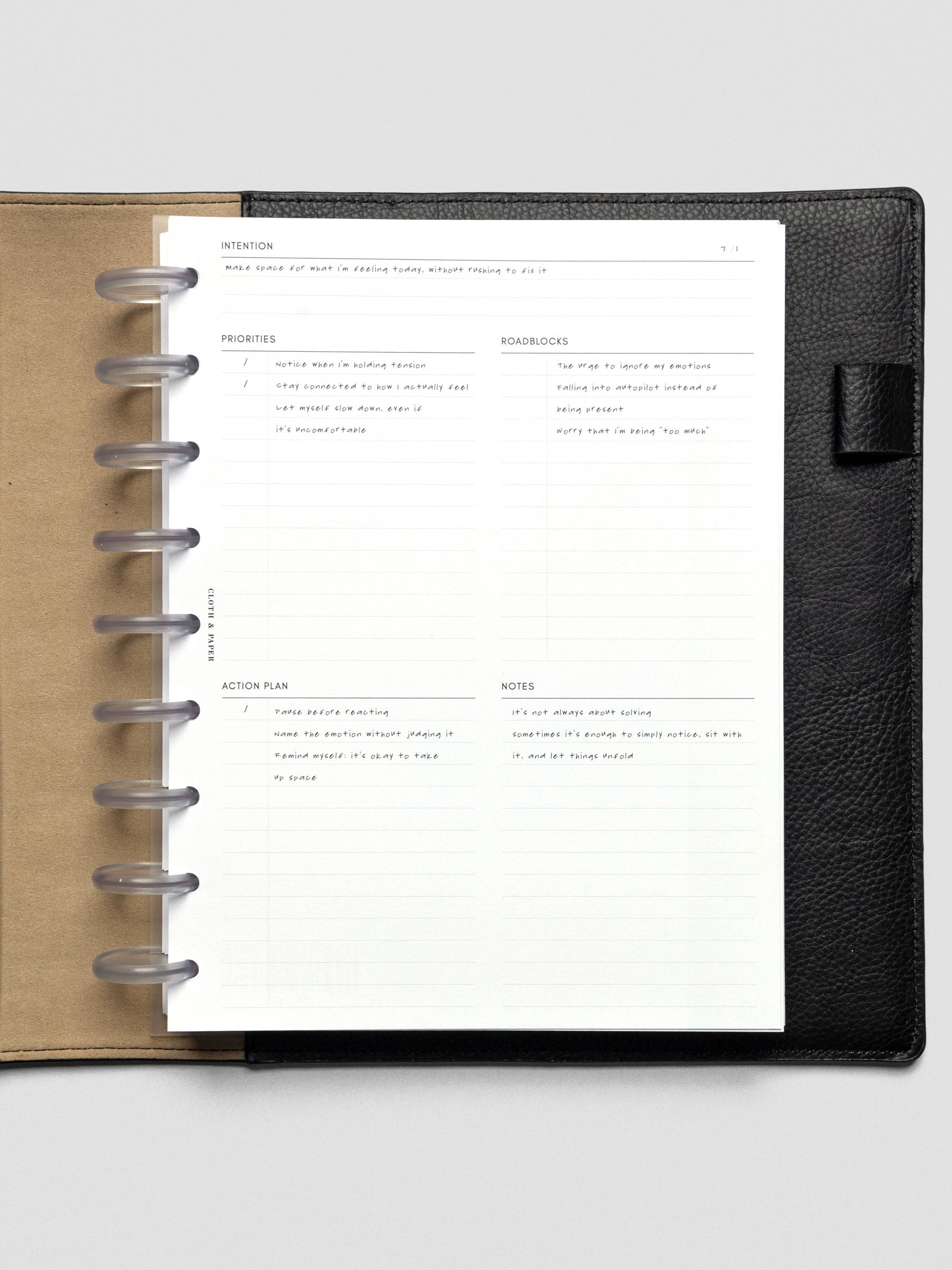 Daily Intention Planner Inserts show filled out in HP Classic size disc bound in a leather cover.