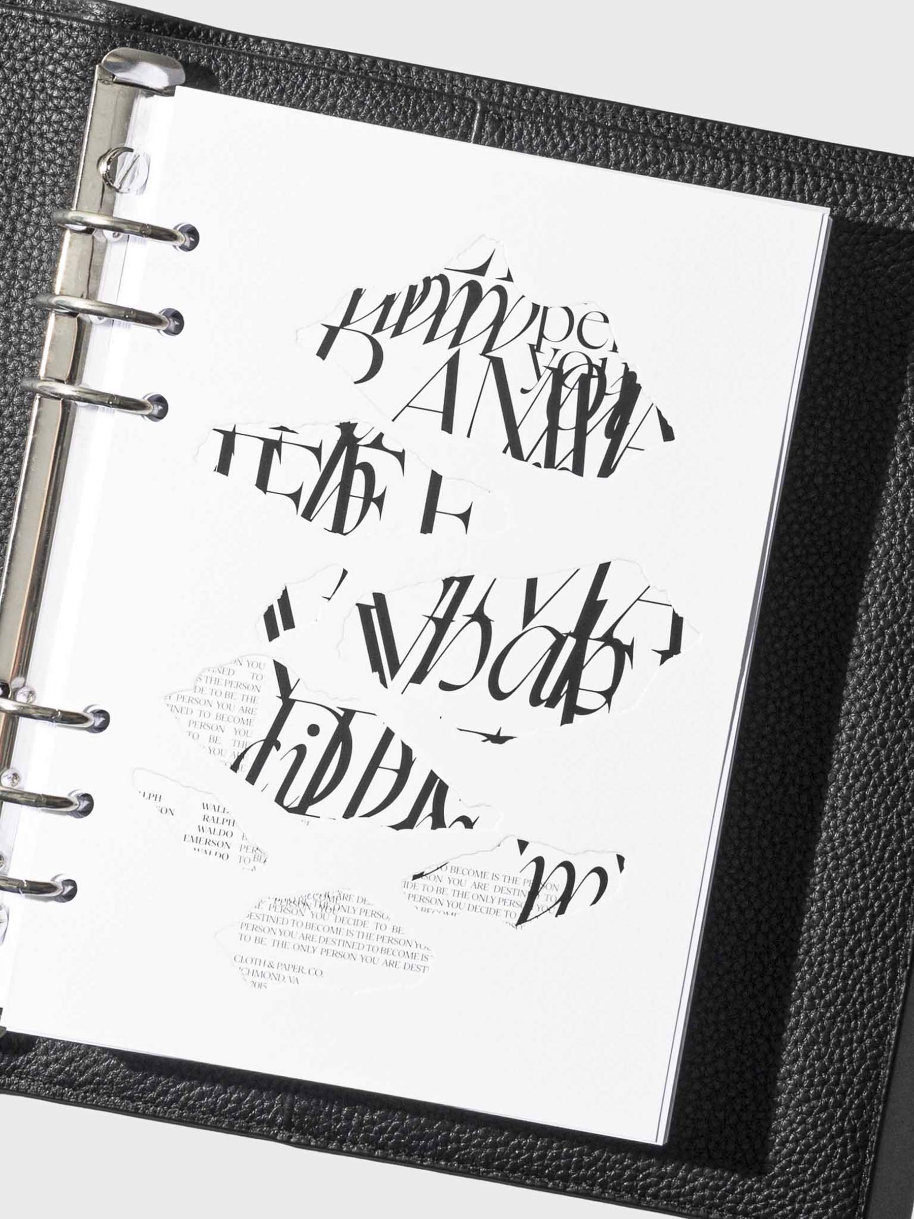 Dashboard in A5 shown inside a black leather agenda on a neutral background.