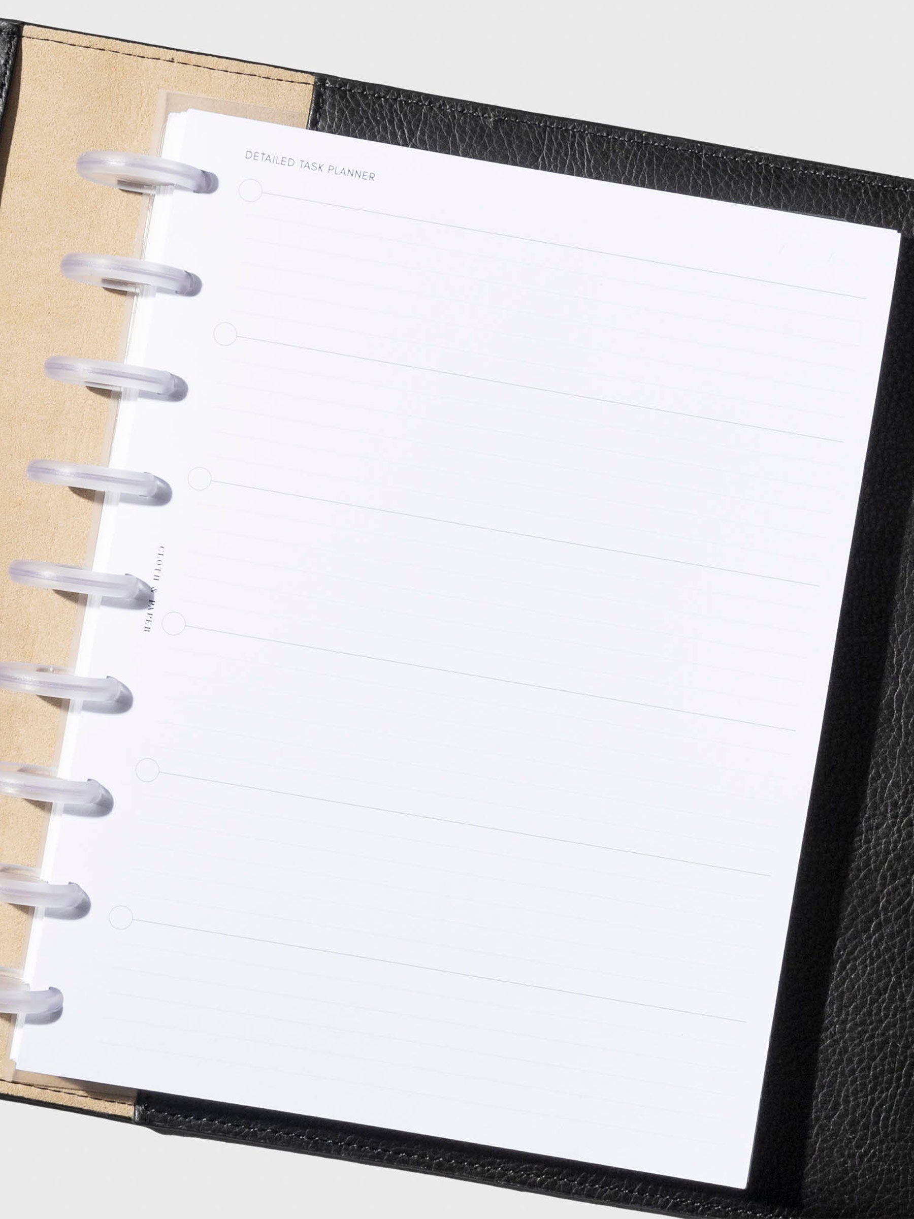 Insert in use inside a black leather folio. Size shown is HP Classic.