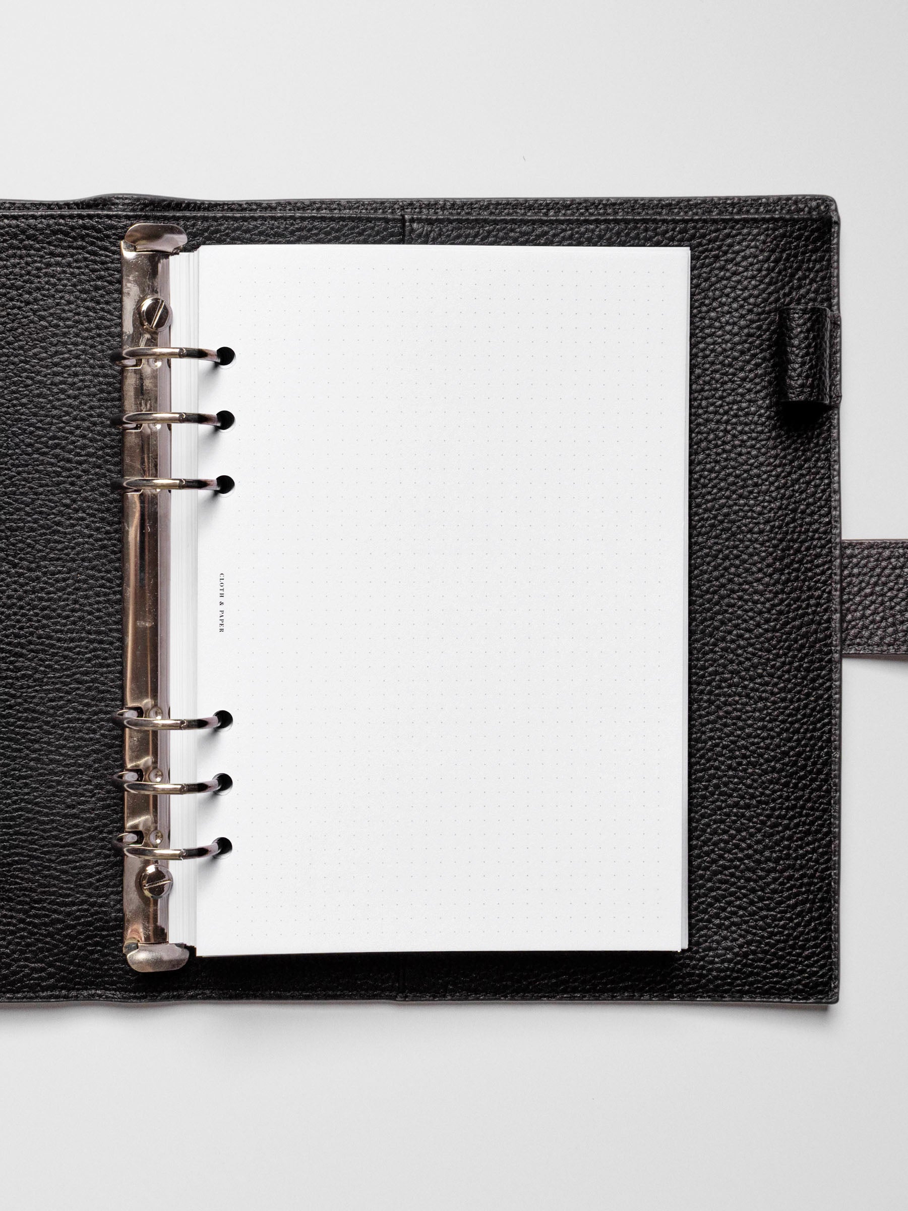 Insert in use inside a black leather planner.