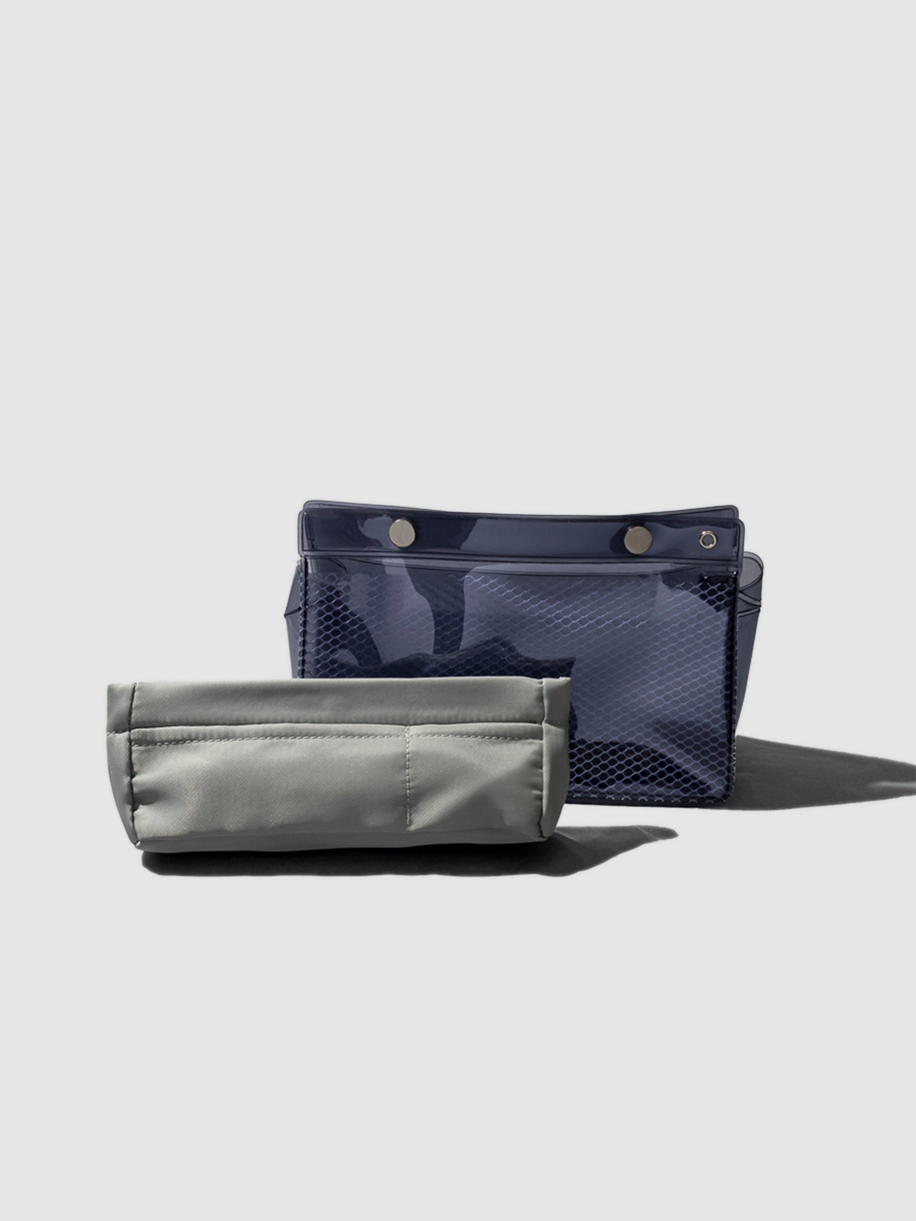 Double Carryall Pouch and Ristretto Liner displayed together on a neutral background.