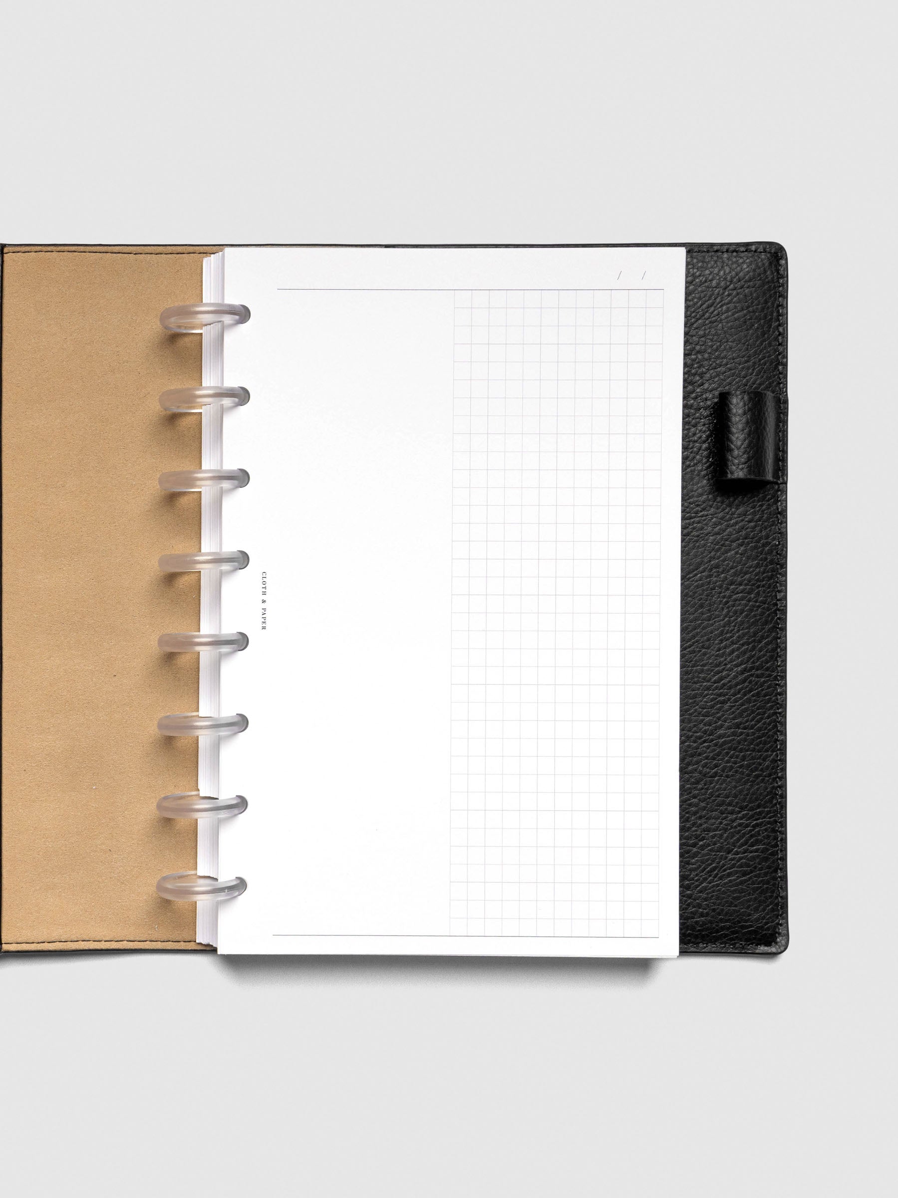Inserts in use inside a black leather planner.