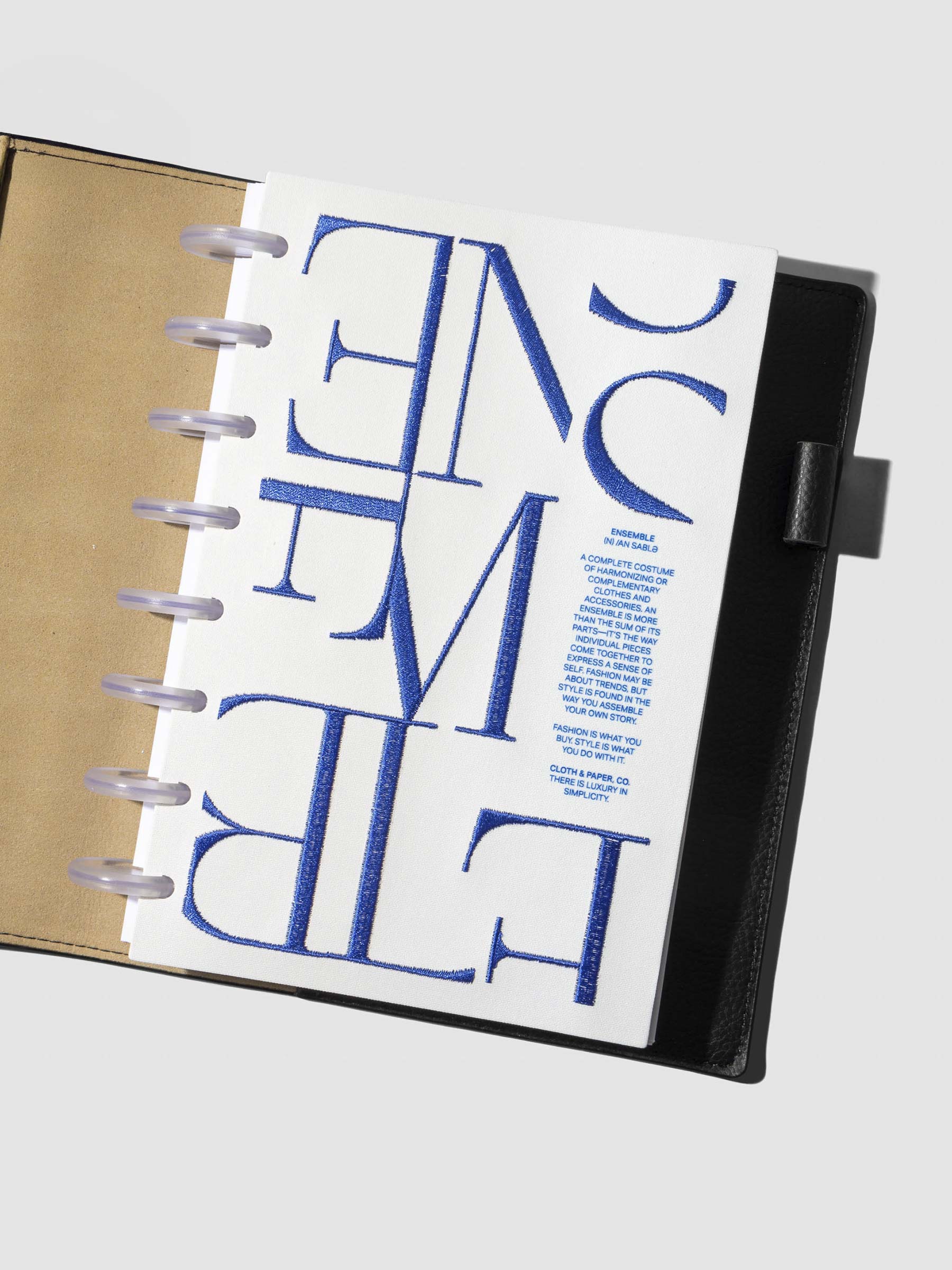Dashboard displayed inside a leather agenda on a neutral background. Size shown is Half Letter.