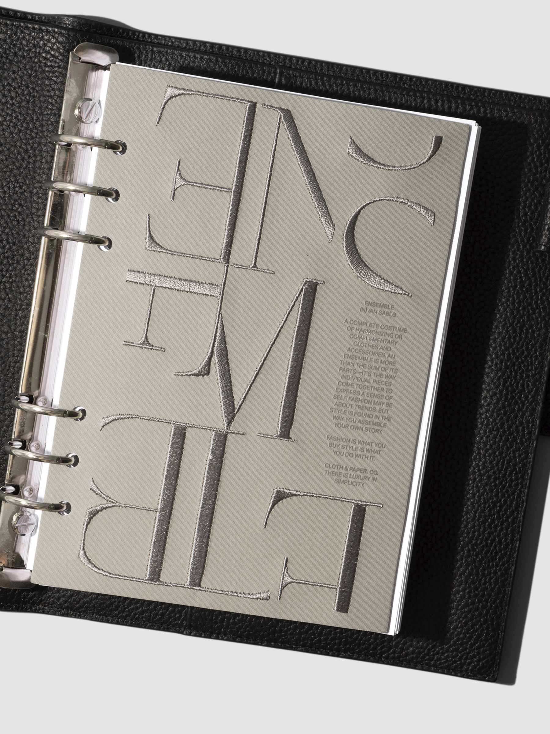 Flat lay of the A5 Ensemble Dashboard Ristretto design paired with planner inserts.