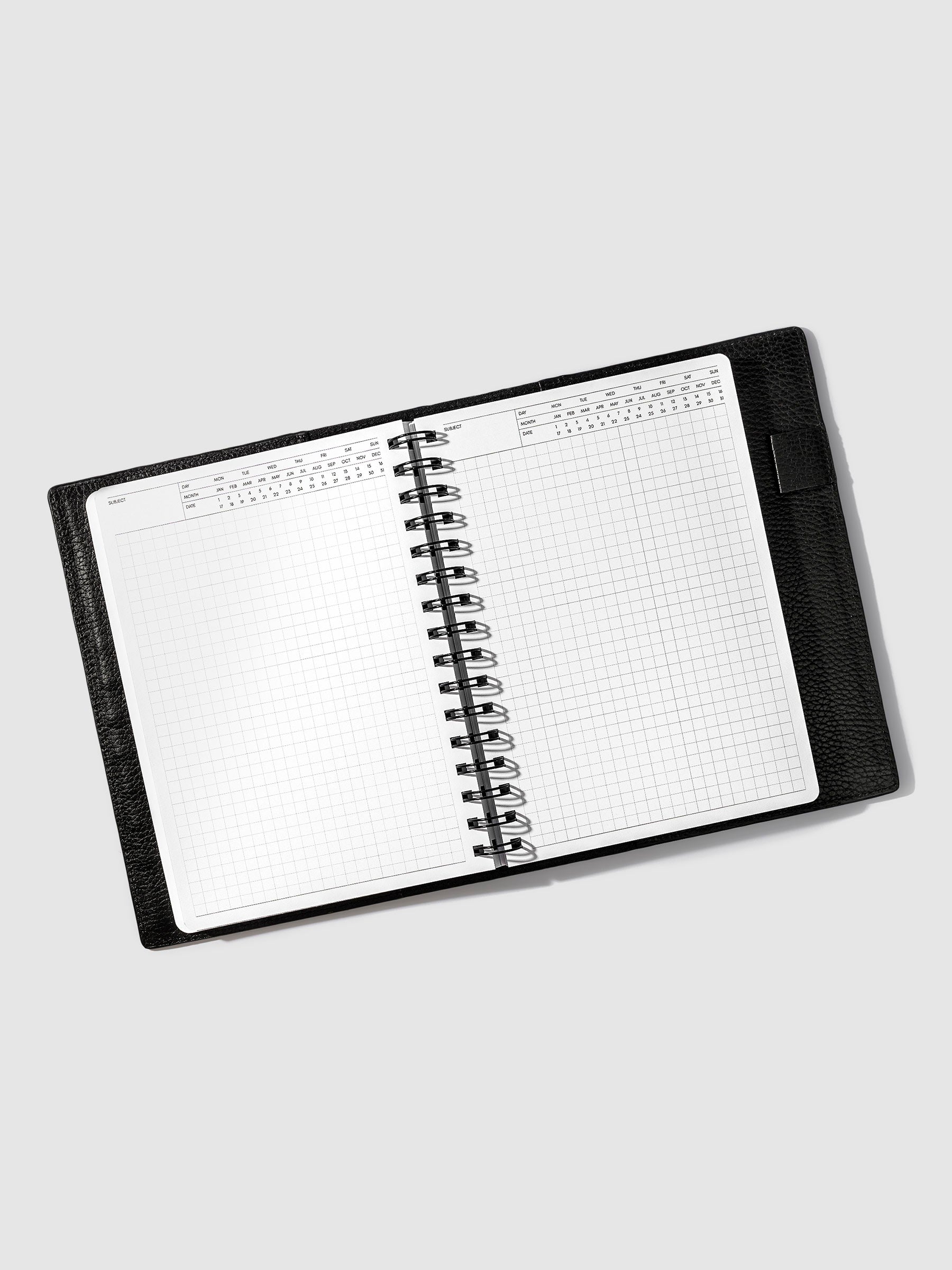 Cafe Noir notebook in use inside a leather planner.