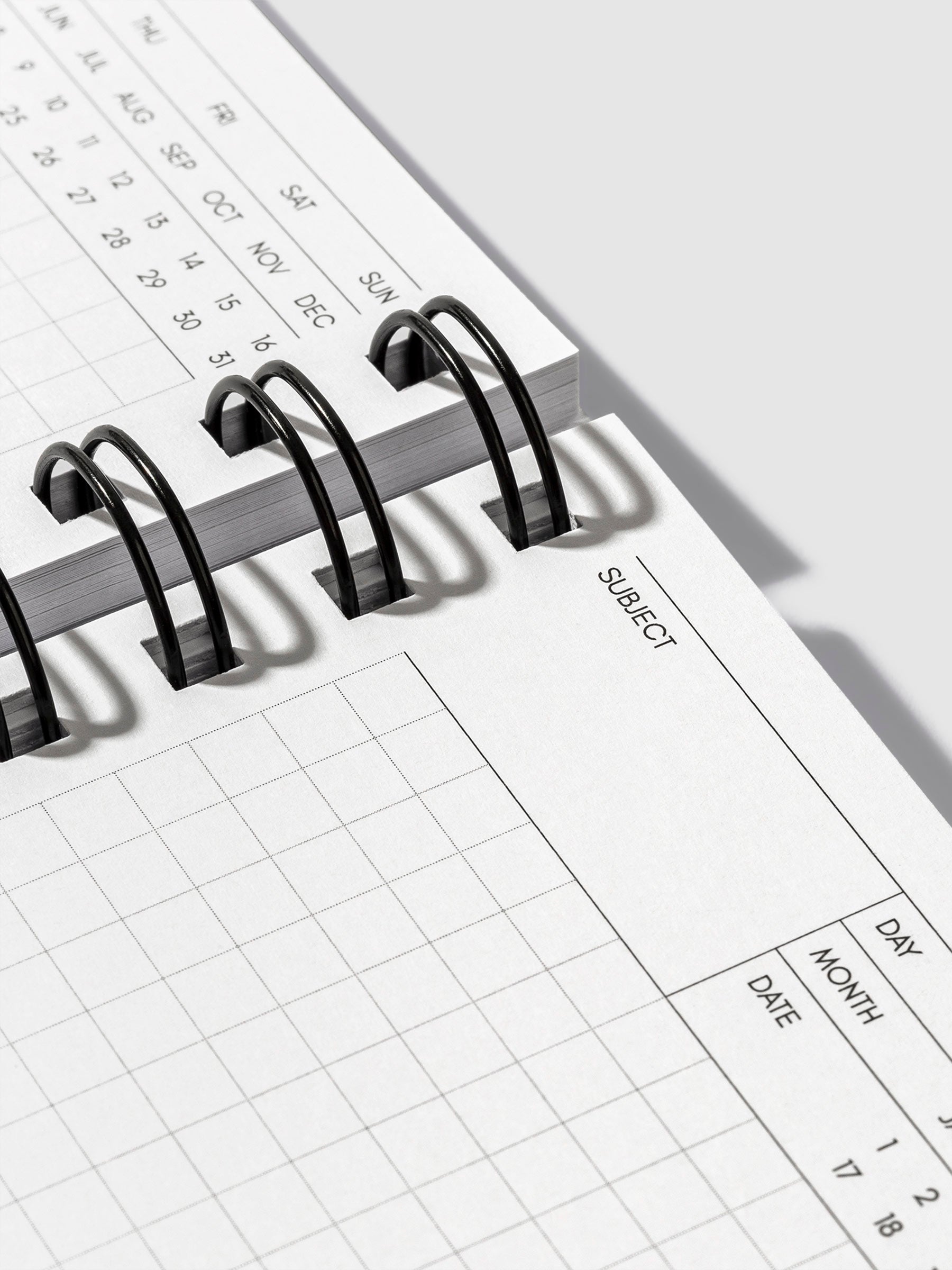 Closeup of subject header and graph paper inside Cafe Noir notebook.