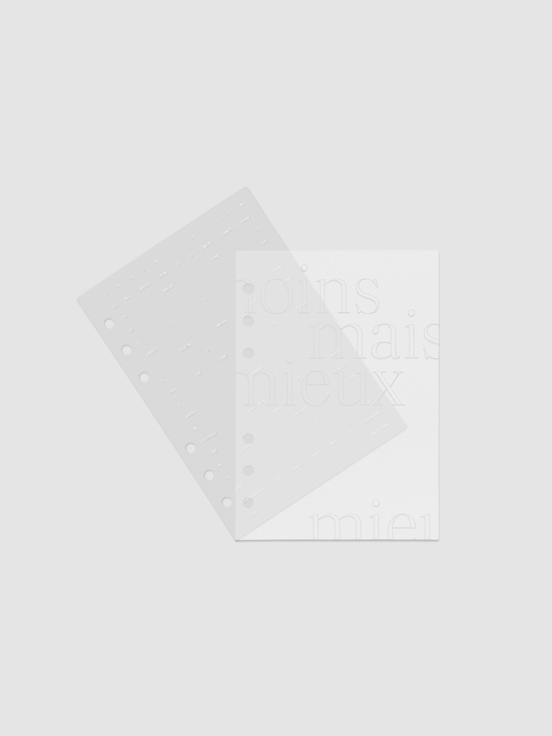 Essentialism Dashboard Duo reading "moins mai mieux" in size Personal Wide; shown with layers offset.