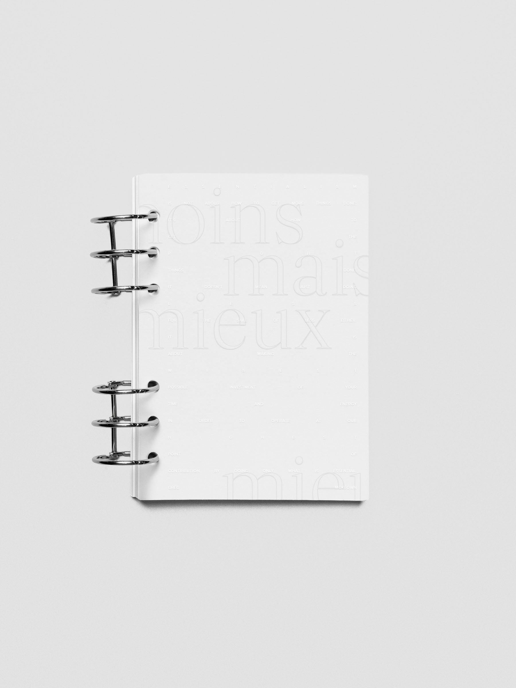 Essentialism Dashboard Duo reading "moins mai mieux" in size Personal Wide; shown ringbound.