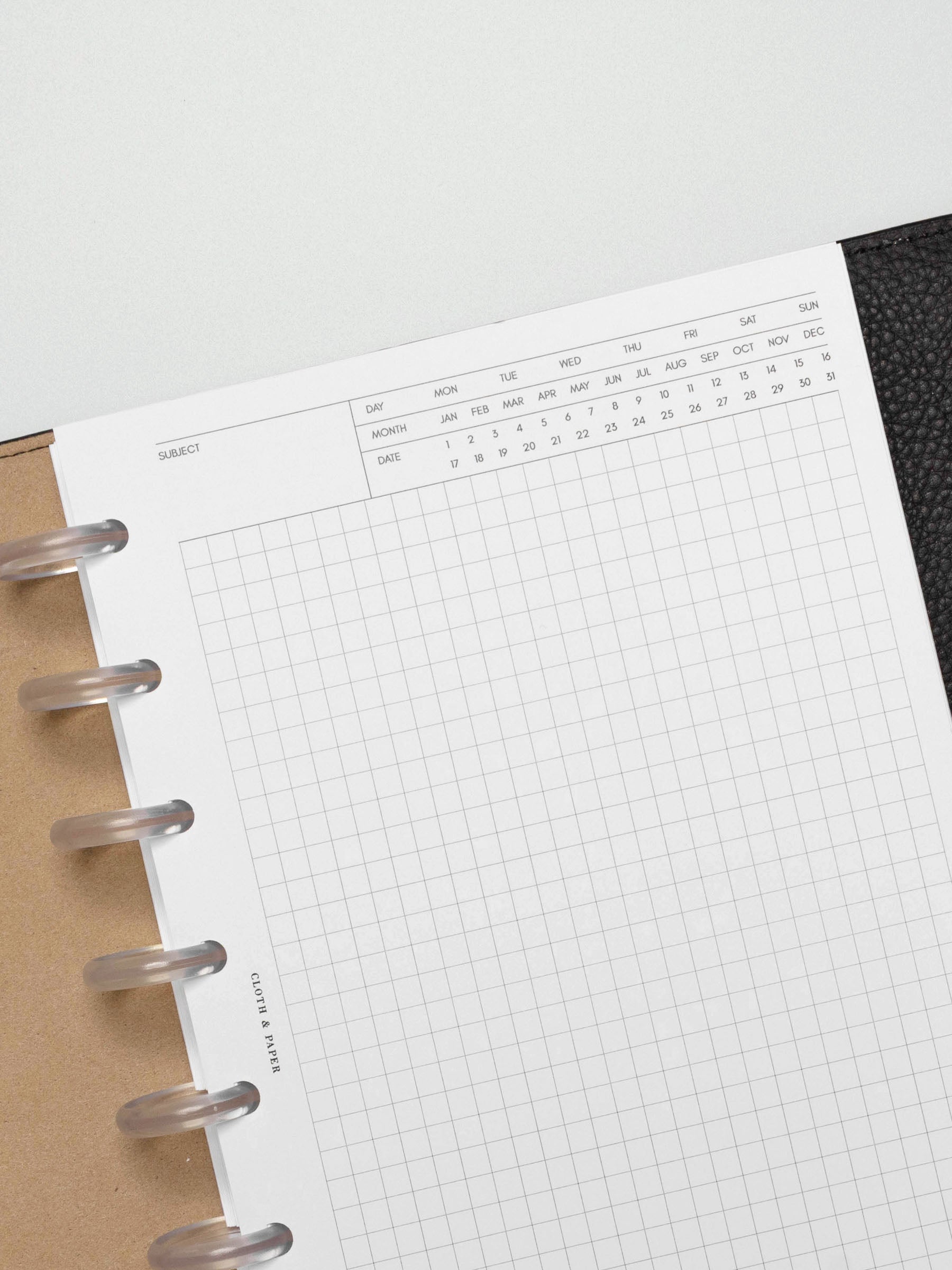 Insert in use inside a black leather planner.