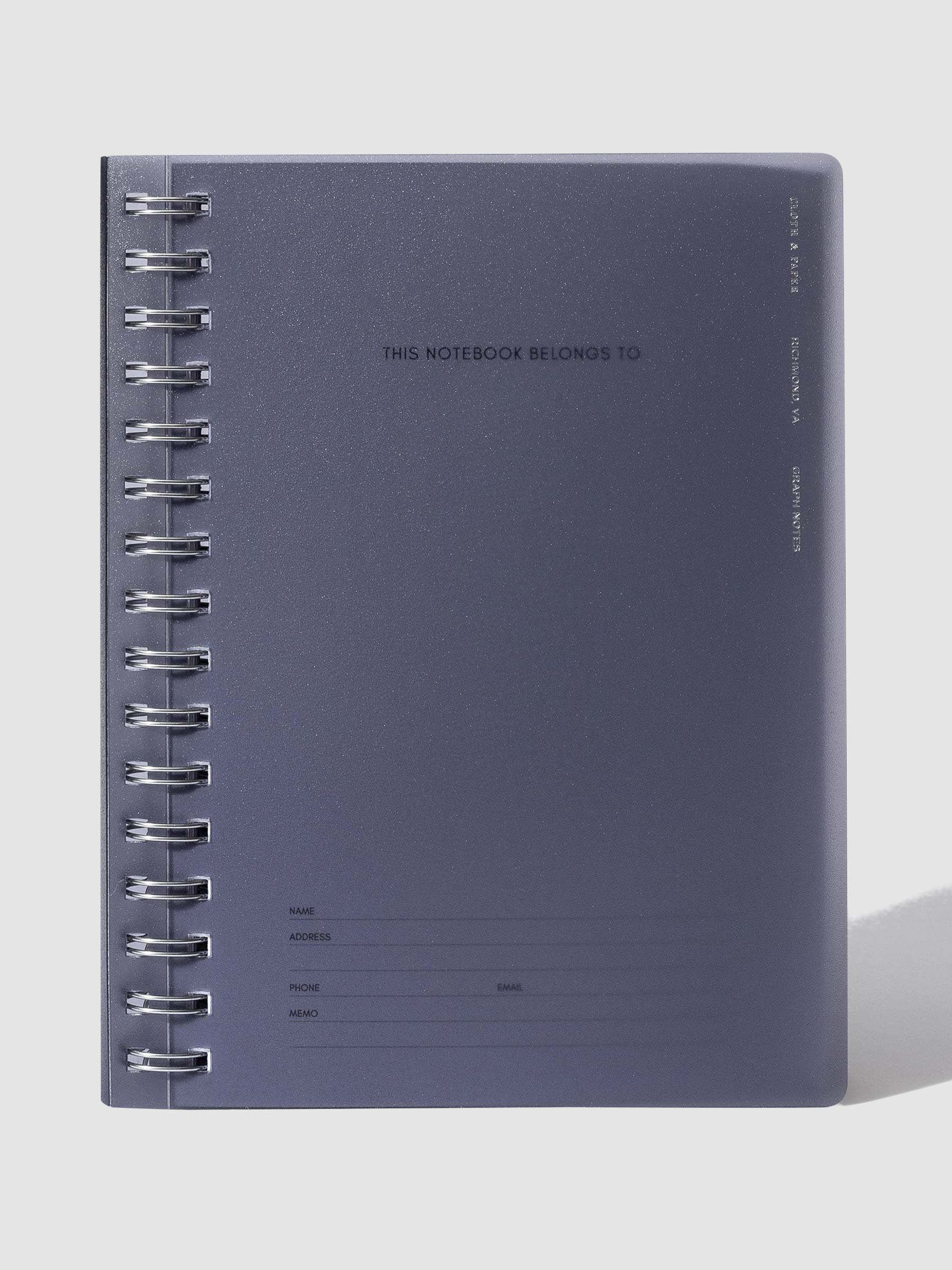 Tinted plastic notebook displayed on a neutral background.