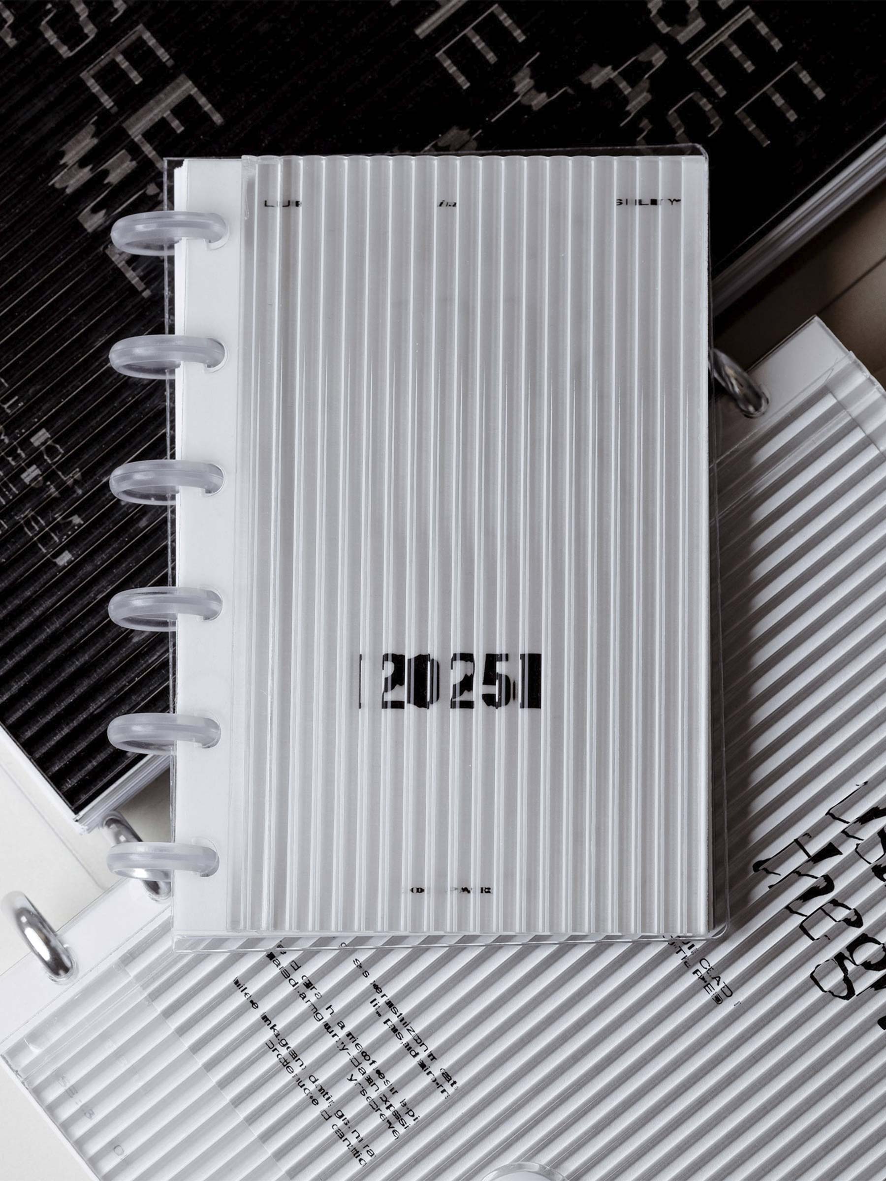 Image shows three fluted dashboards used as the covers of various disc planners.